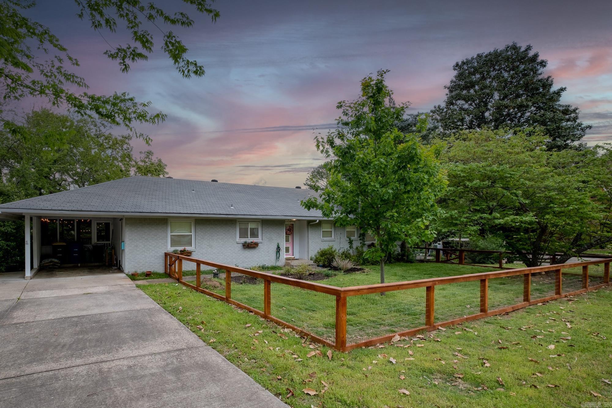 Great family home in desirable Park Hill has endless space for your family. Upstairs has an updated kitchen, complete with new flooring, backsplash, corian countertops, farmhouse sink, faucet, convection range and vent hood. Step into your living/dining combination with a fireplace and a wall of windows overlooking the backyard. Off to the side is a great screened in porch for relaxing on beautiful days! Down the hall is the primary bedroom with an updated bathroom including separate shower and clawfoot tub, a huge closet as well as two additional closets. Also on the first level is an additional bedroom and full updated bath. Downstairs are 3 additional bedrooms, a living area, a full bath as well as 400 s.f. of heated and cooled storage space. The backyard features a hot tub/pool/spa combo with a large deck. Updates, excluding the kitchen, are a new water heater, new sewer line, interior paint, two newer AC units - 2023 and 2024, privacy fence in the backyard as well as a new fence in the front of the home. Agents, exterior pictures are virtually staged. Refrigerator, washer and dryer convey.