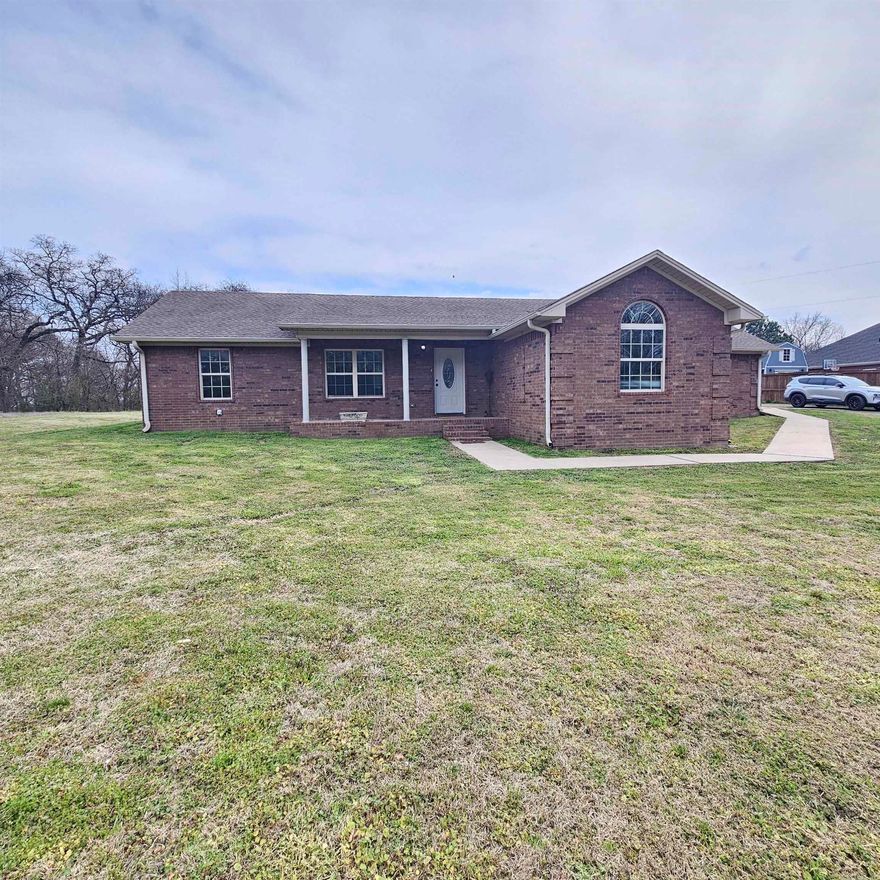 Private country living with convenient access to town! Located at 4546 AR 105 in Atkins, this home sits on a peaceful 3-acre lot while remaining just minutes from schools, restaurants, and shopping. The flexible floor plan offers 4 bedrooms and 2 bathrooms, or 3 bedrooms with a bonus room ideal for a home office, playroom, or extra living space. Enjoy outdoor living on the covered patio, perfect for relaxing or entertaining, and take advantage of the outbuilding for storage, hobbies, or a workshop. This property offers space, privacy, and versatility without sacrificing location—an ideal blend of country feel and everyday convenience.