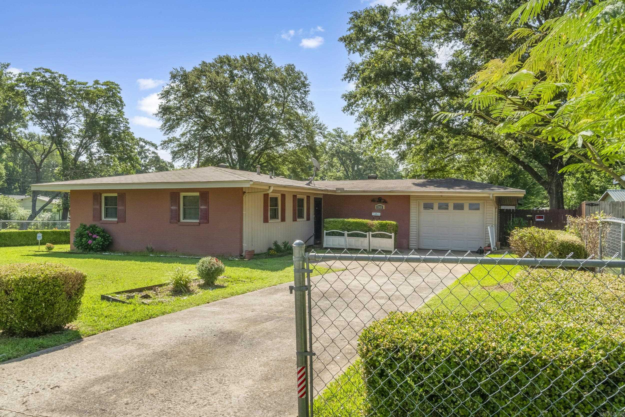 This cute and cozy 3-bedroom, 1.5-bath home is full of potential and conveniently located just minutes from the Air Force Base. Situated on a spacious corner lot, it offers great curb appeal and extra yard space. Inside, you'll find a functional layout perfect for comfortable living, and the attached garage includes a storm shelter for added peace of mind. Whether you're a first-time buyer, downsizing, or looking for an investment opportunity, this adorable home checks all the boxes!