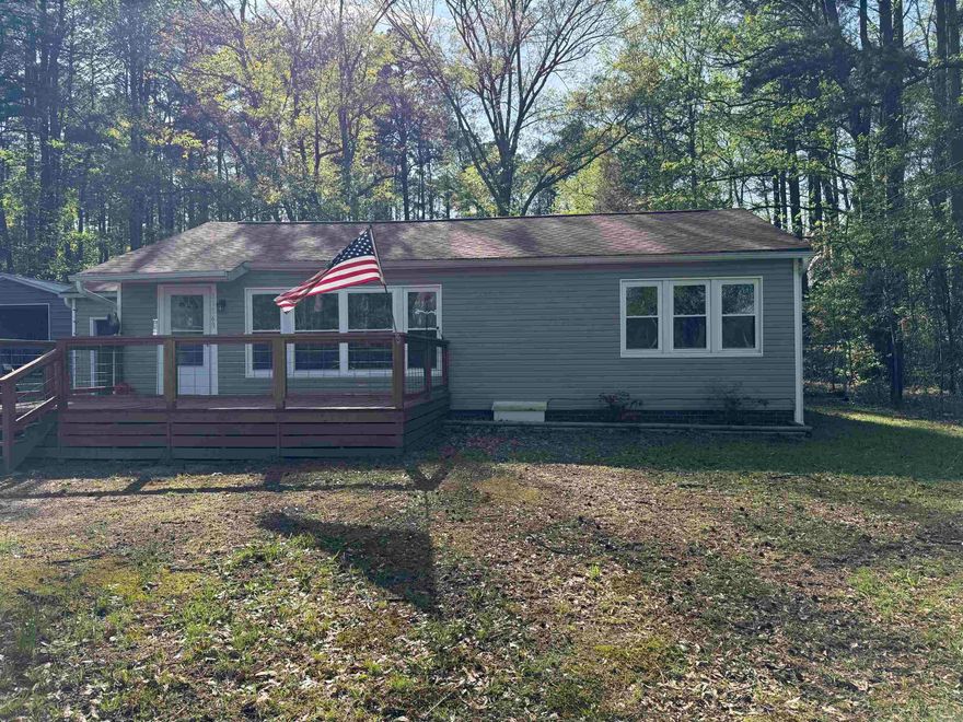 This house has been completely updated!!! New windows, new septic, new roof, new carpet, electrical. 30x40 insulated shop with electric garage door. This home is move in ready and located just outside of town sitting on .50 acres. Agents, see remarks for more info