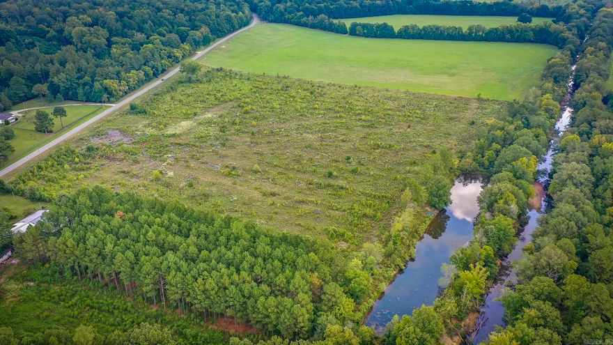 Discover your own slice of Arkansas paradise with this approximately 28-acre property just outside the city limits of Arkadelphia. Backing up to the Ross drainage ditch and featuring a small pond, this land is ideal for those seeking hunting, recreation, or a private retreat. With 1,000 feet of highway frontage, access is convenient for building, investment, or future development. Whether you’re a hunter, land investor, or someone dreaming of a secluded getaway, this acreage delivers: Abundant wildlife including deer, turkey, waterfowl, and small game—perfect for year-round hunting and outdoor recreation. A small pond for fishing, waterfowl attraction, or simply enjoying quiet evenings in nature.  Opportunities to build your dream home, cabin retreat, or multiple cabins for hunting leases and getaways.  Just minutes from downtown Arkadelphia, home to Ouachita Baptist University and Henderson State University, plus shopping, dining, and healthcare. Outdoor lovers will appreciate quick access to DeGray Lake, the Ouachita River, and local state parks—all within a short drive. This property offers the balance of privacy, accessibility, and lifestyle opportunity!