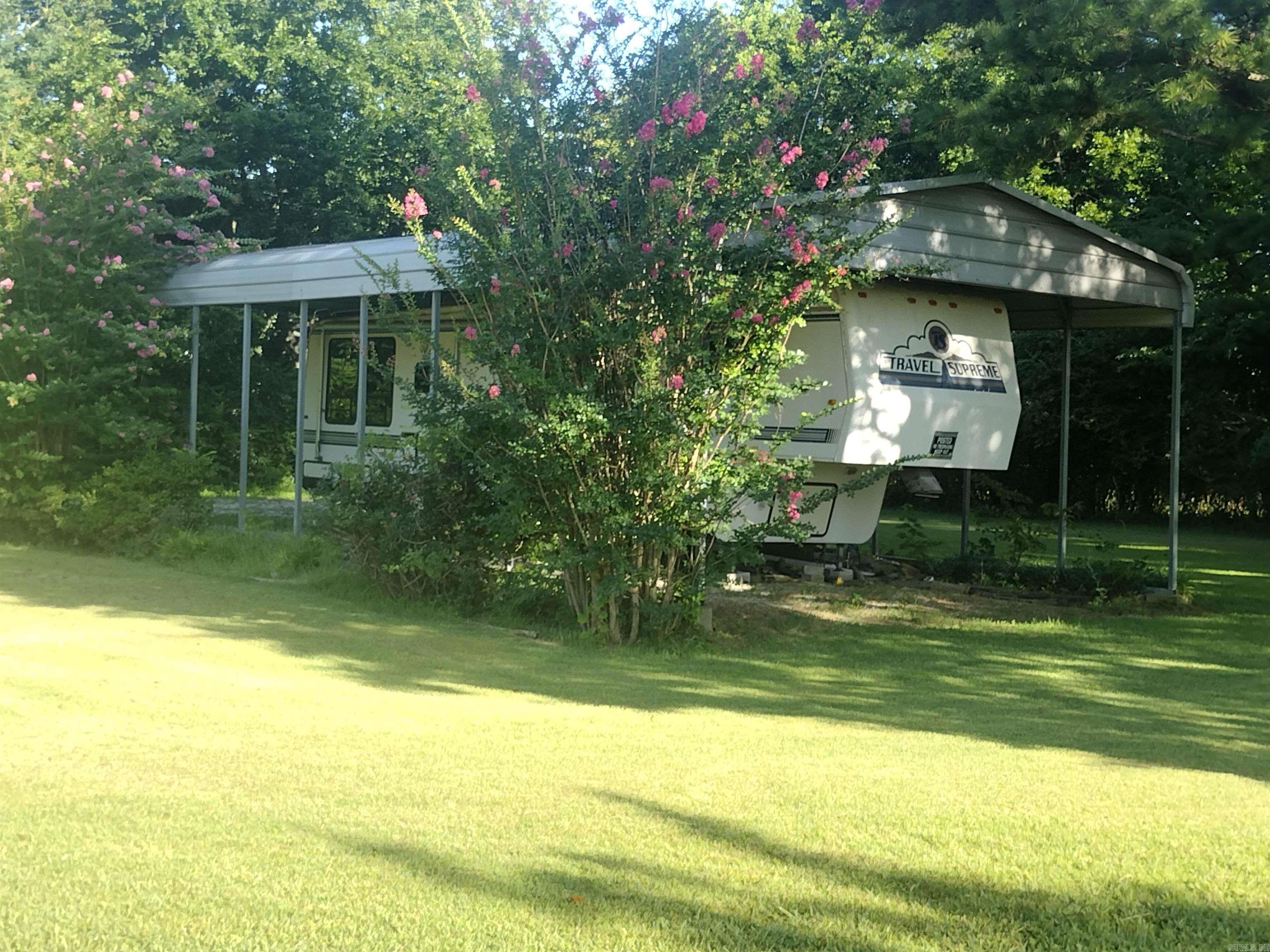 Corner lot with mountain views approx. .3 to the courthouse square RV and RV shed convey with property, is being used as Airbnb