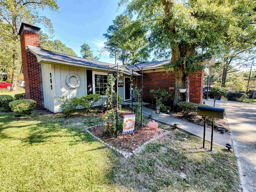 This charming 3-bedroom, 2 bathroom home offers comfort and functionality in a desirable    neighborhood. The open family room features a gas log fireplace and connects to a spacious dining area. The kitchen has plenty of cabinet space and a cozy breakfast nook. The recently updated energy-efficient windows help reduce utility costs. Outside, enjoy an expansive deck and patio area, and for added versatility, there is a concrete pad previously used for an above-ground pool, perfect for your next DIY project! The fully fenced yard, additional 10'X12' storage building, double carport, and 12'X20' shop with electricity run to it complete this great package. Offering a $5,000 flooring allowance upon acceptable offer. Schedule a viewing today!   Square footage, year built, and lot size taken from courthouse records.