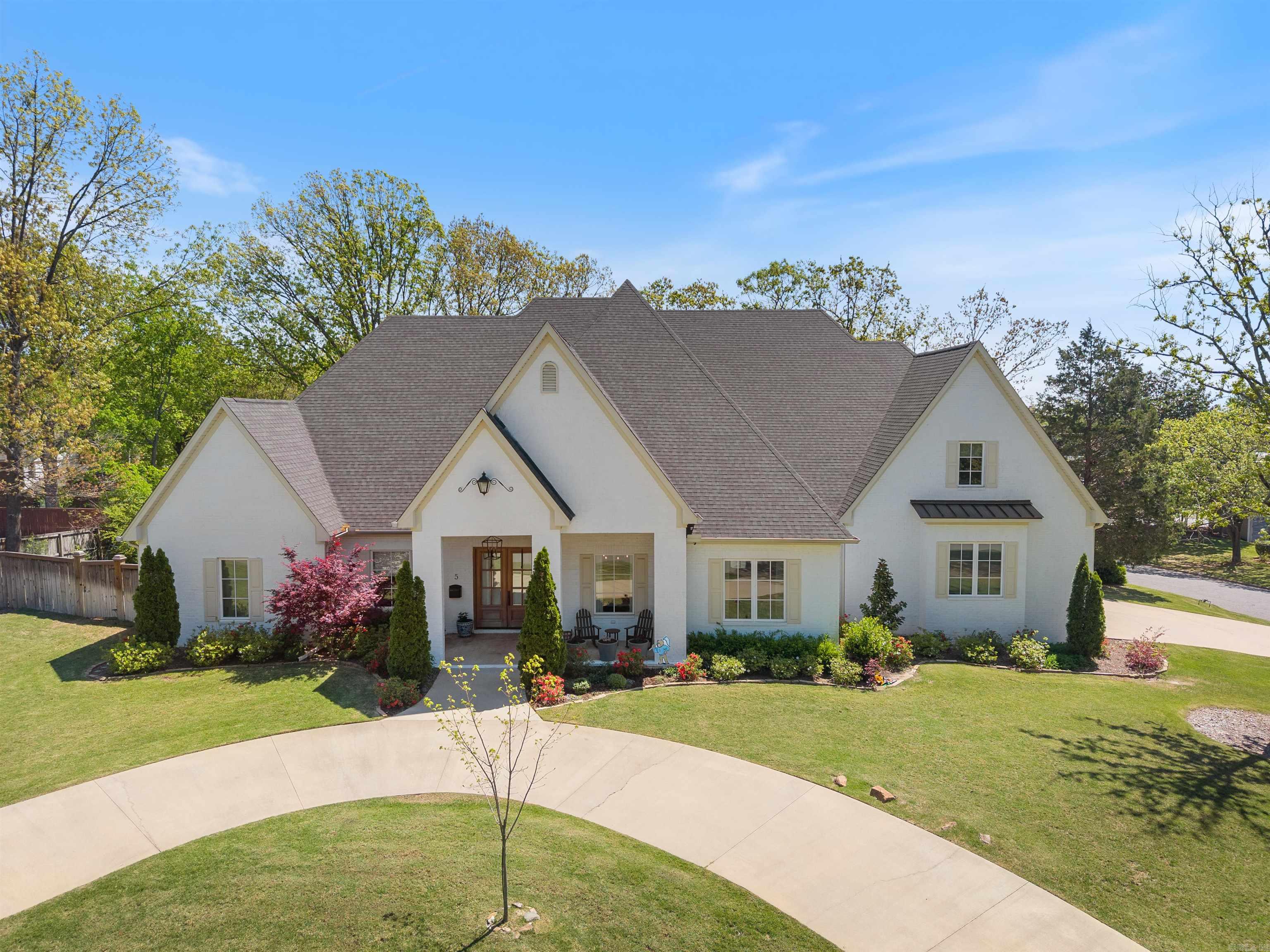 Stunning 2020-built home in Pleasant Valley offering timeless architecture and high-end finishes throughout. Located on a corner lot adjacent to the Pleasant Valley Golf Course, this 4 bedroom/4.5 bathroom home offers a wonderful floor plan. Main level highlights include: a formal dining room, office with French doors and built-in cabinets, and a great room with fireplace and beautiful custom cabinetry. The chefās kitchen boasts KitchenAid appliances: a commercial gas range with pot filler, double ovens, built-in fridge/freezer, walk-in pantry, and a wet bar in the breakfast area. The main-level primary suite offers a spa-like bath and spacious walk-in closet. A guest suite is also on the main level. Upstairs has two bedrooms with private baths and walk-in closets, a large game room, attic access, and a 2nd laundry service. Outdoor features include a screened porch with fireplace, fenced backyard, circular drive, and side-entry 3-car garage. Additional features include: sight finished hardwood floors, 10ā ceilings and 8' doors on the main level, 9ā ceilings upstairs, Pella windows and doors, mud room and incredible main level laundry room with beautiful design! See agent remarks!