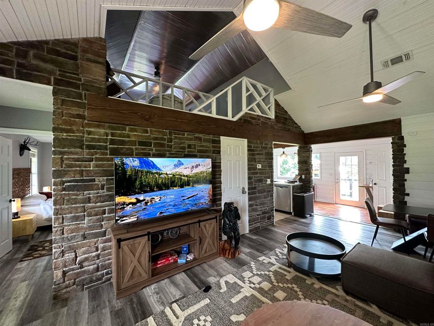 Don't miss this opportunity to live on the Caddo River in a Vacation Rental Property through Thanksgiving, Christmas & New Years. Calling all Snow Birds, escape the frozen North. Experience Riverside Serenity in Glenwood! Nestled on the banks of the enchanting Caddo River, discover a cabin retreat that marries rustic charm with luxurious comfort. Whether you're looking for a romantic getaway or a family adventure, our cabin promises an unforgettable stay. Revel in the grandeur of a living room crowned with soaring cathedral ceilings. King-sized bed nestled in the master bedroom & a master bathroom beckons with a spa-style bath & shower area.