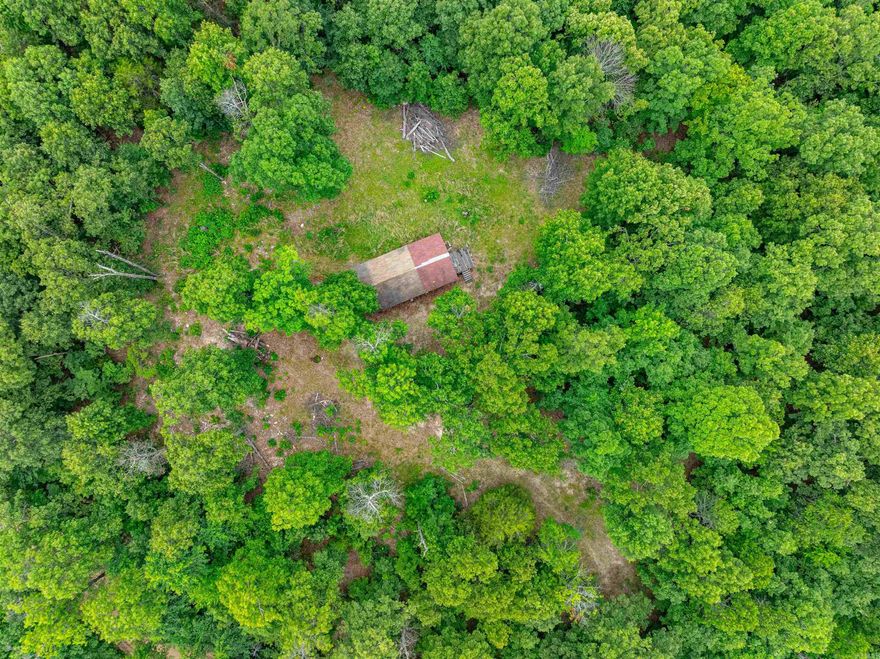 This is 32 +/- Acres, all wooded, has gravel road frontage and a gate at entry, and has an old cabin that does not have water or electric (both is available at road).  Current sellers use generators to bring in their water.  This would make a great hunting property with a place to stay, and there are about 10 +/- acres of this that are separated by another parcel of land, but there is access.  With this, you have a place to stay and a place to hunt separately if you want to, but all be right there together.  This being all woods, you have a ton of whitetail deer and turkey, along with squirrels and the occasional bear, just a few miles from downtown Hardy, Arkansas.  Call us, and let me help you get to the Ozarks to live that American Dream!  This would be a great place to teach those grandkids about hunting!  Let us be your guide.