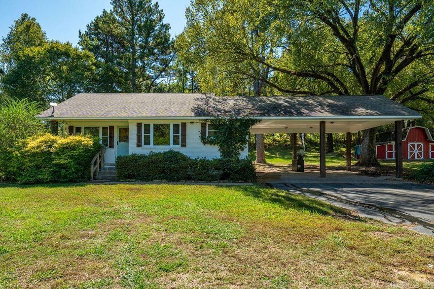 Must See - Fabulous location! This charming, remodeled, home features beautiful wood floors and a renovated luxury farmhouse kitchen that’s sure to impress. Surrounded by mature trees on a gorgeous piece of land in the highly sought after Fountain Lake area, this property offers peace and privacy while still being close to town. Enjoy the large barn perfect for storage, animals, or hobbies, and a delightful child’s playhouse in the backyard that adds to the home’s warm, welcoming character.
