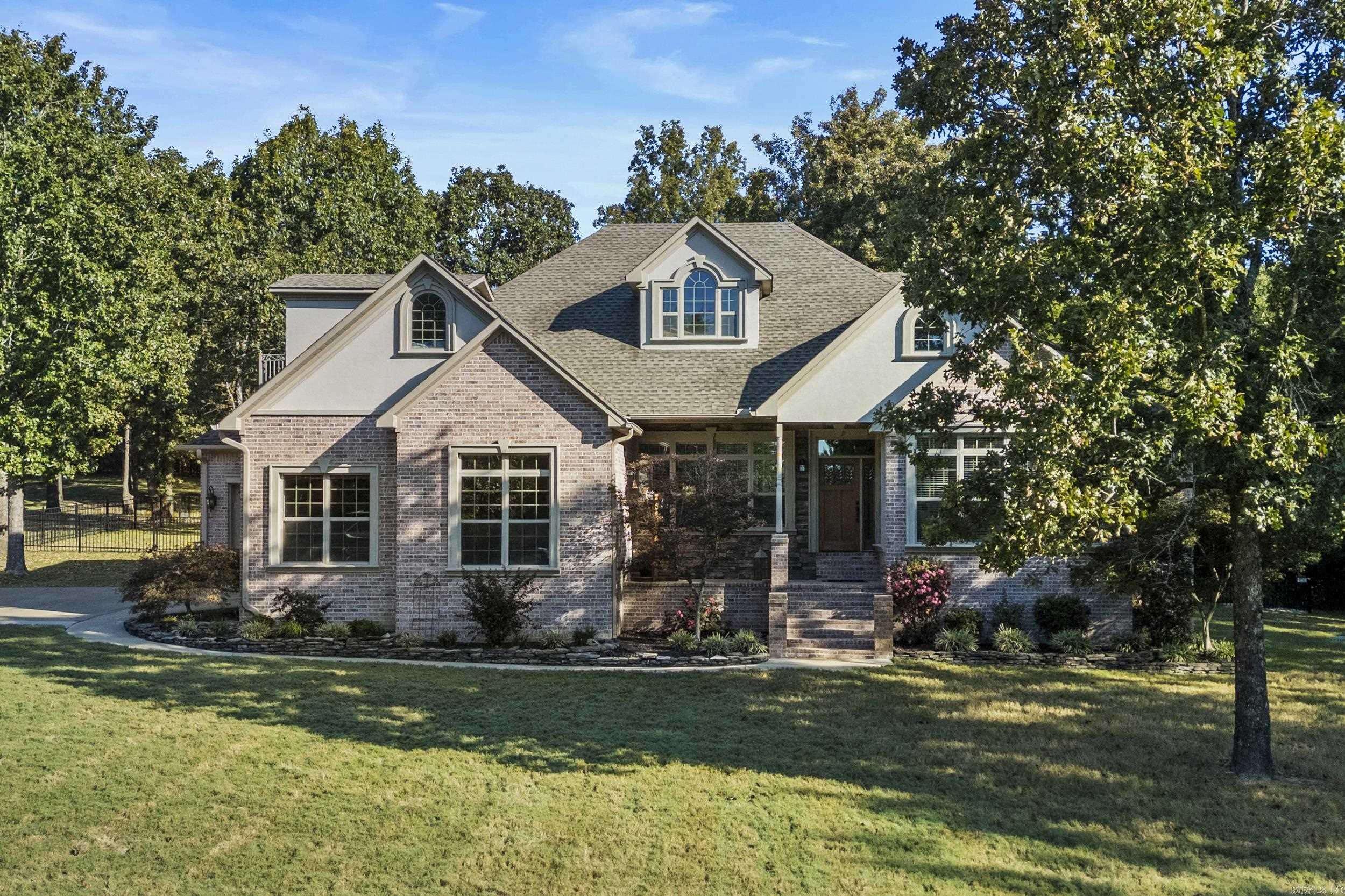 Beautiful home west of Searcy on over 2 acres with gorgeous hardwood floors, formal dining room, large kitchen with double oven, gas cooktop, island, spacious pantry, granite countertops, new light fixtures, breakfast room, vaulted ceilings in the living room & some great built-ins! There is an inviting sunroom on the front of the home that could can be used as a large office/playroom/2nd living area with built-ins. The bonus room upstairs acts as a 4th bedroom & has a huge closet/storage room and its own half bath plus brand new LVT flooring! The primary suite boasts tray ceilings, two closets, walk-in shower, separate lavatory, double vanity & crown molding for an extra touch. Downstairs baths & laundry have been updated with new tile flooring, vanities & light fixtures & laundry has a sink as well as loads of cabinets & counter space! Backyard has a huge deck, patio space, fenced area and even raised beds for gardening! Don't miss the storage closet in garage as well as the 3rd garage for car/golf cart or just a shop area! Make this beautiful home your new piece of paradise!