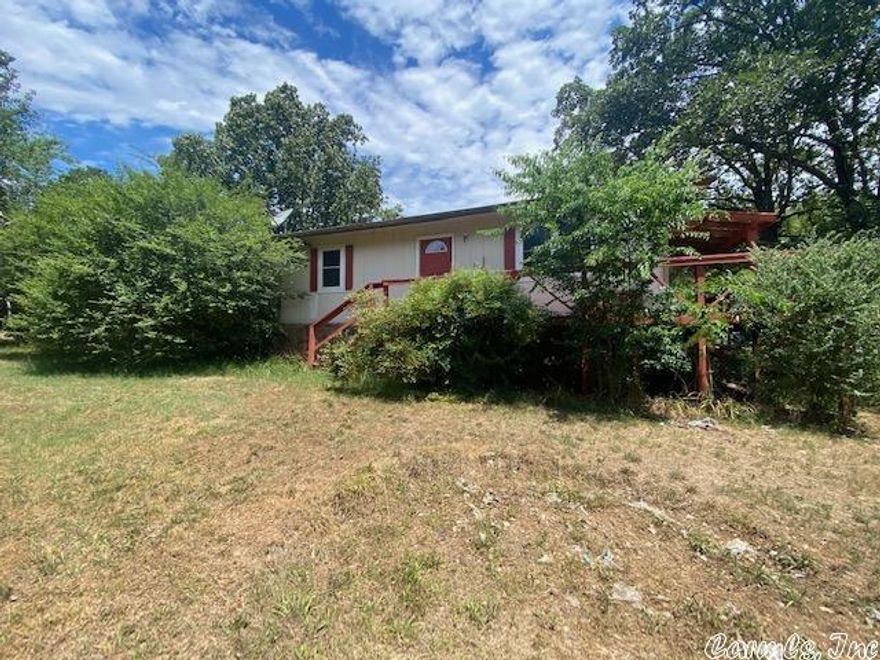 Great Home in the Heart of Heber Springs only .4 miles from Lake access this home has a fireplace nice sized bedrooms, and a beautiful yard with an extra lot to equal almost an acre in Town!!!! This would be great home for someone wanting to make their own.