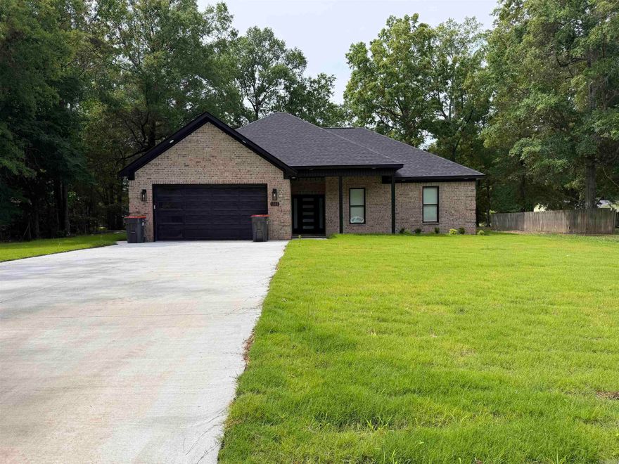 This beautifully crafted new construction home offers the perfect blend of comfort, style, and thoughtful design. Featuring three spacious bedrooms and two well-appointed bathrooms, every detail has been carefully considered to create a truly inviting living space. Situated on a gorgeous lot, the property is enhanced by professional landscaping and elegant soffit lighting that adds both charm and curb appeal, day and night. Inside, the open-concept kitchen flows seamlessly into the main living area, making it ideal for entertaining or everyday living. The large master suite serves as a private retreat, complete with a luxurious soaker tub and a beautifully tiled walk-in shower. Stunning flooring runs throughout the home, tying each space together with a polished, modern feel. With no detail overlooked, this home combines quality craftsmanship and stylish finishes to deliver a space that is as functional as it is beautiful. Taxes are based on vacant lot.  Measure square footage for accuracy.