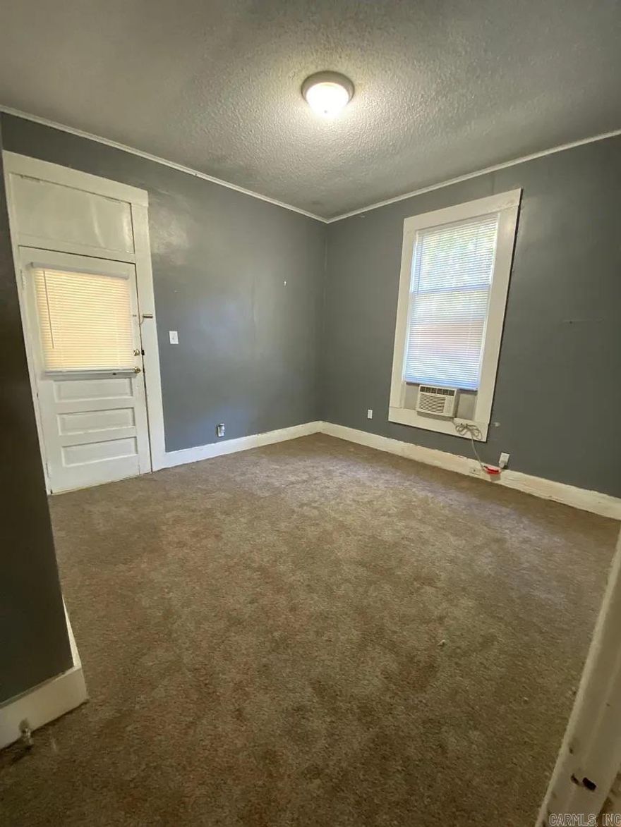 Delightul House has been utilized as a triplex with three functioning apartments.  Great investment and rental property with plenty of charm.