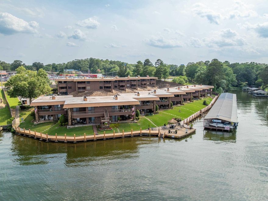 Looking for a full-time vacation? Welcome to The Harbor—your lakeside retreat on beautiful Lake Hamilton! This updated ground-level 2-bedroom, 2-bath condo offers 1,360 sq ft of stylish comfort and panoramic water views right from your private patio. Whether you’re sipping morning coffee or winding down with a sunset glass of wine, the lake is always your backdrop. Move-in ready!  This gated community offers resort-style living with a sparkling pool, boardwalk for evening strolls, and a swim dock to soak up the summer fun. Inside, enjoy modern finishes, a spacious open layout, and plenty of natural light. Perfectly located near shopping, dining, and medical services, you’ll love the convenience as much as the relaxation.  Whether you're searching for a full-time residence, weekend escape, or investment opportunity—this one checks all the boxes. Don't miss your chance to live the lake life—schedule your private showing today!