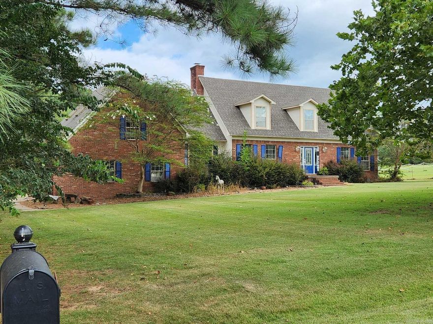 Two story home on 5 acres with a shop.