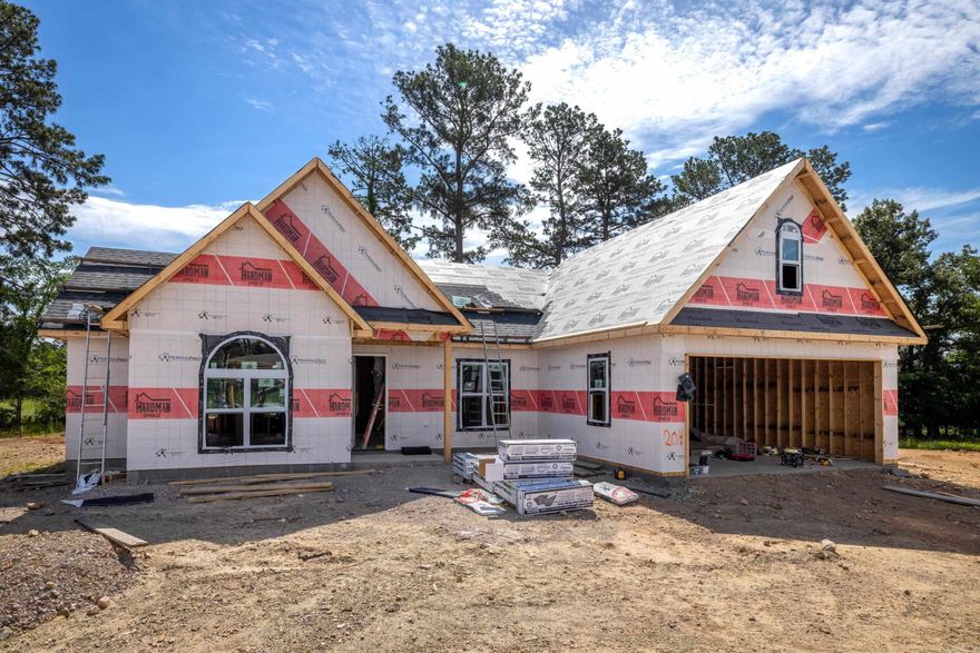 UNDER CONSTRUCTION in the highly sought-after Lake Hamilton School District! This stunning 1,561-square-foot all-brick home in Walkway Point offers the perfect blend of quality, location, and modern efficiency. This thoughtfully designed single-story layout features three spacious bedrooms and two full baths, along with a versatile bonus room perfect for a home office or playroom. Built for long-term savings, this home includes energy-efficient appliances, a 95% high-efficiency furnace, and a tankless gas water heater. The heart of the home is a designer kitchen highlighted by a large granite island that flows seamlessly into the expansive great room, making it ideal for entertaining. You will find high-end finishes throughout, including durable laminate and tile flooring (no carpet), energy-efficient insulated windows, and a sleek all-brick exterior. Complete with a welcoming front porch and a level lot just minutes from Lake Hamilton, this brand-new build is a premier choice for those seeking a high-performance home in a top-tier school district.