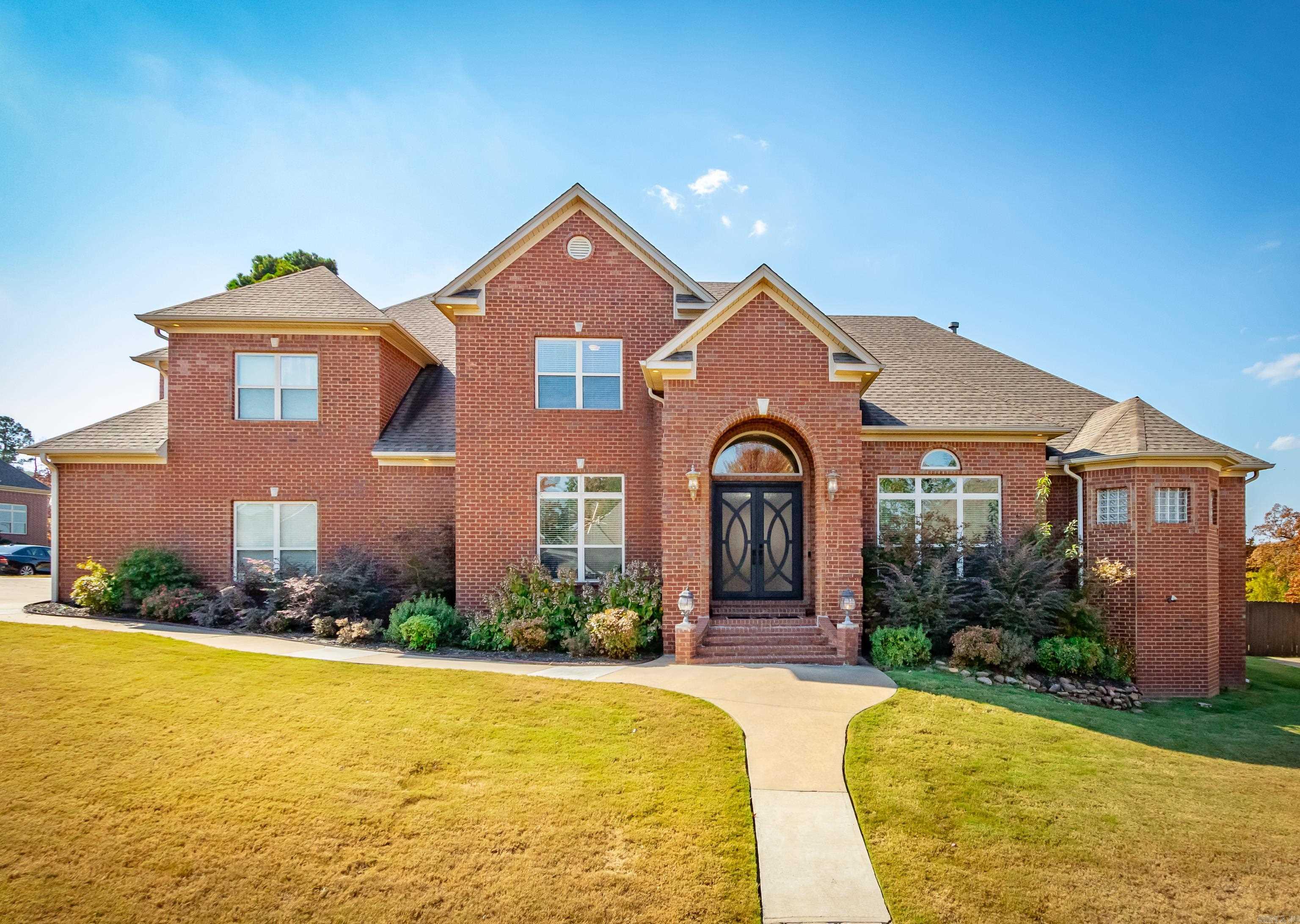 This Stunning Chenal Valley Epernay Home sits on a corner lot with a 3 Car Side-Loaded Garage. This home offers An Executive Office with Glass French Doors, A Great Room focal point gas fireplace with a beautiful view of the outdoors covered patio. The incredible gourmet chef's kitchen offers a 5 burner gas cook top, breakfast bar and granite counter tops with an island. The Master Suite Bedroom with a fireplace has access to the patio is privately located from the three additional guest bedrooms. The Exquisite Master Bathroom feature an immaculate walk-in shower, his and hers toilets, sperate vanities and jetted tub. Upstairs features an Ensuite Bedroom with a full bathroom and two additional bedrooms with Jack & Jill Bathroom. Entertain with ease in the Must See Theater Room with awesome Theater Seating and Bar. Covered patio with an extended deck, basketball court and fully fenced backyard. New Iron Front Door 2024, Theater Room total remolded 2024, Fresh Paint 2024, New Light Fixtures 2024 and A/C Unit 2 years old. Agent See Remarks