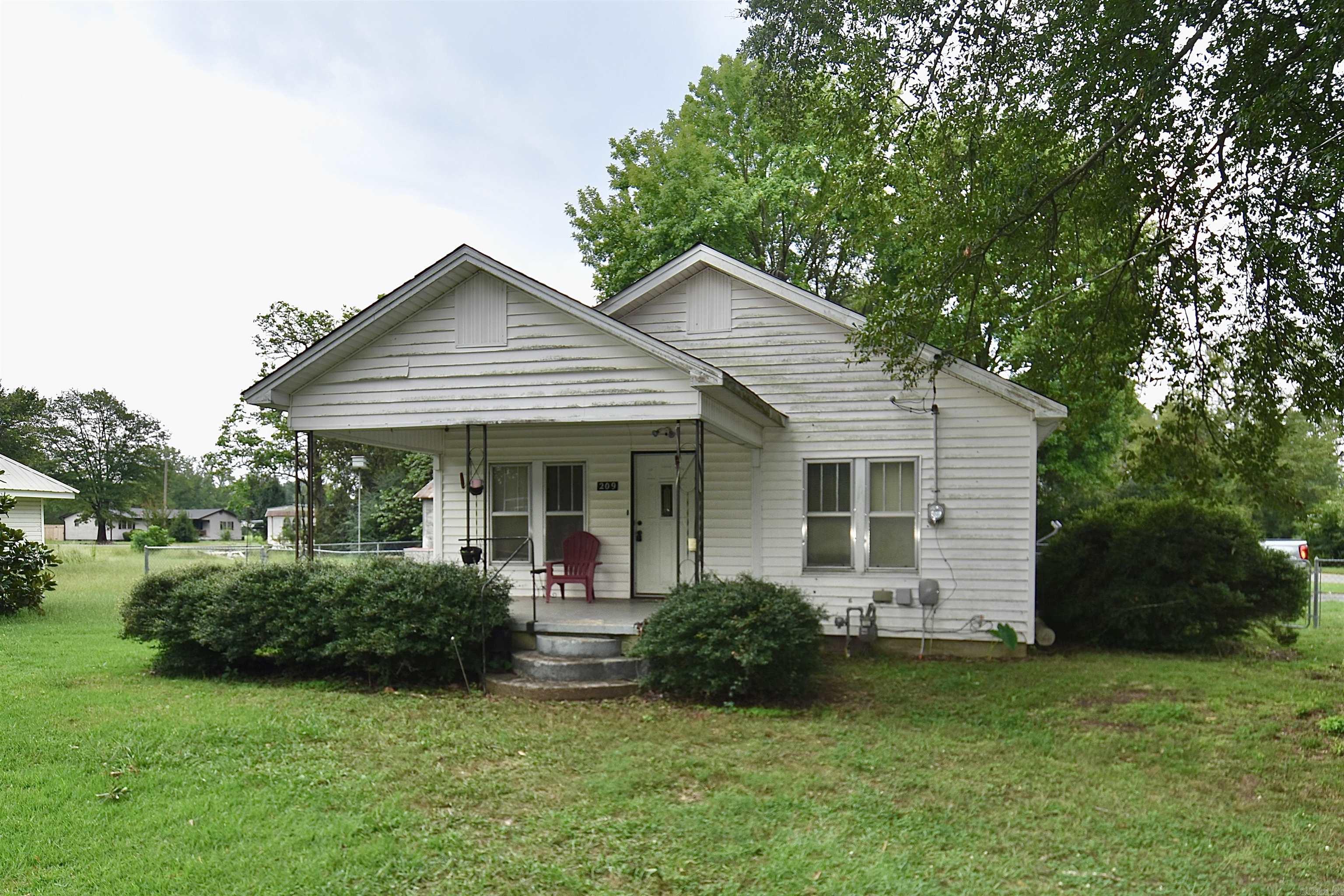 Welcome to 209 S Hall St! This charming 2-bedroom, 1-bath house offers both comfort and convenience. The property features a detached garage, making for a perfect workspace or storage area, along with a one-car carport for convenient covered parking. The fully fenced backyard is ideal for pets or outdoor activities, and the inviting front porch is the perfect spot to unwind. Inside, you’ll find an inviting eat-in kitchen, a dedicated laundry room, and a bathroom that has been recently updated with new flooring and a stylish new vanity. The roof and AC unit are less than 3 years old. Property is being SOLD AS IS. Do not miss your opportunity to make this charming house into a home.