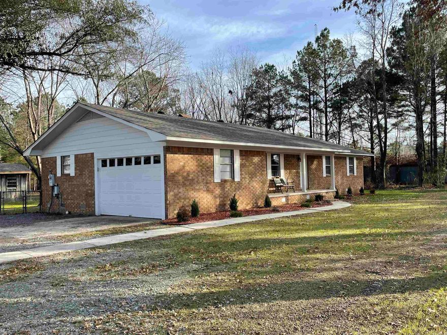 Need a place for horses? This property has a two-stall barn with tack room*Full brick home on 2.66 acres within 1 mile of Sheridan*new roof*new flooring*new paint inside and out*HVAC new in 2021*new water heater*updated electrical*new dishwasher*stove and refrigerator only 1 year old* nice 14'x20' workshop/shed that has been updated including new roof*barn has been updated*land in gorgeous*landscaped nicely*bring your horses and kiddos*3 bedrooms and 2 baths with two living areas*all appliances stay including washer and dryer*the barn is 36'x28' and has a 12'x16' tack room*SELLER WILL PAY $5000 in buyer's closing costs!
