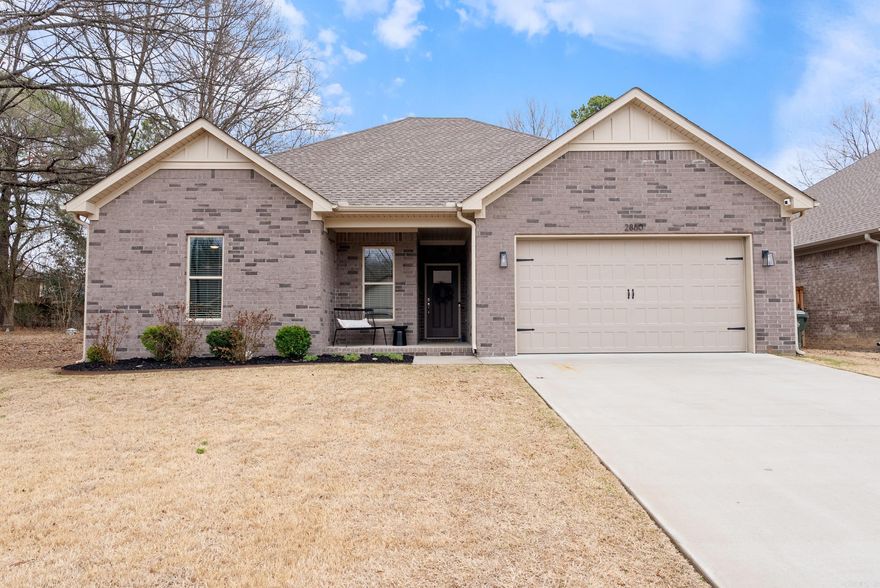 Wow! A NEWER home built in 2022 in NW Conway is available for your family.  It is the largest fenced yard in the subdivision of Carmichael.  May family memories were made sitting on the front and back porches along with watching movies on the outside attached TV.    The kitchen is bright with white cabinets, and stainless appliances. It is oversized and can easily hold a big island for extra counter space and storage.   It won't last long, so be first to see it!