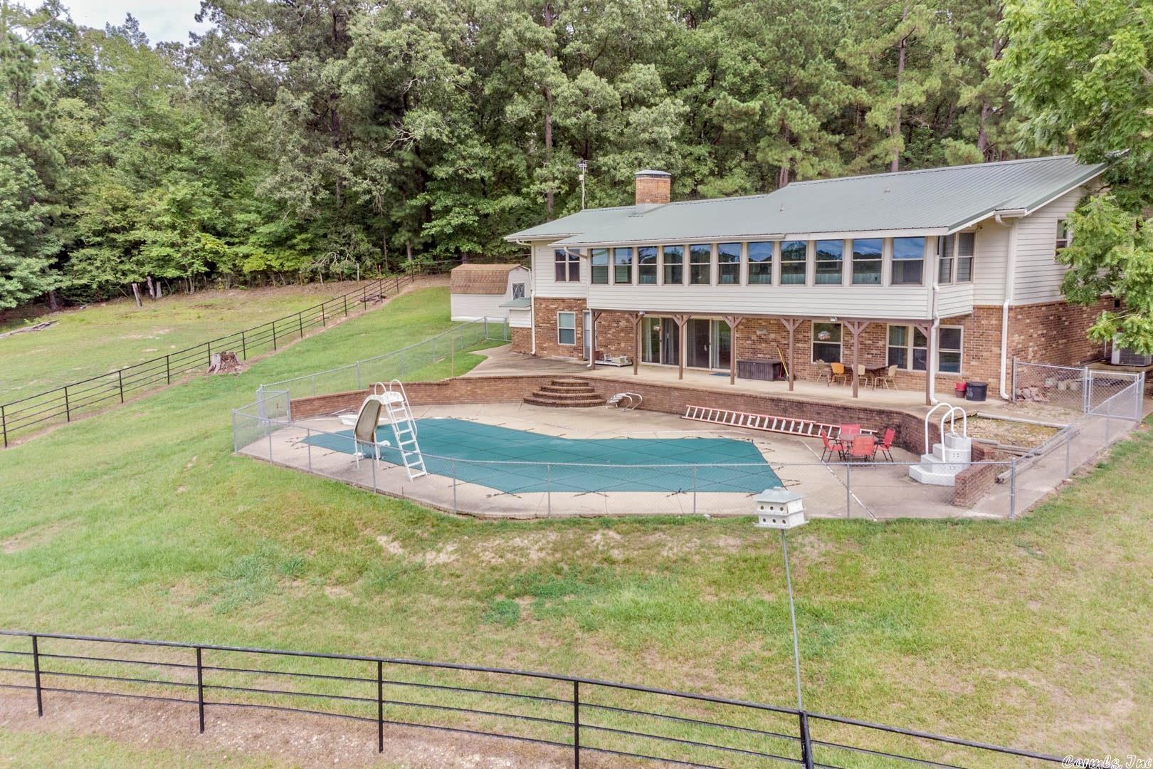 Your own spot of Heaven on Earth. This property offers, 156.76 acres of pasture land, fencing & cross fencing, pole barn, Pipe fenced cattle corral, 2 ponds and year around creek, see Virtual tour. House offers SO much, updated kitchen with large island & all appliances convey, 2 fireplaces one has large insert. Downstairs offers large living space, 2 bedrooms and large bath with jetted tub and walk-in shower plus walkout doors to an amazing inground pool. See assoc documents for additional amenities.