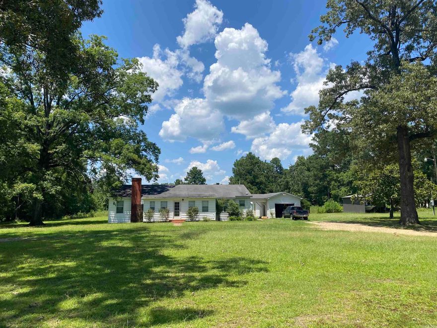 This charming 3-bedroom, 2-bath residence boasts 1,968 square feet of living space. The interior has been thoughtfully updated, featuring a brand-new kitchen and renovated bathrooms. Situated on a spacious 5-acre lot outside the city limits, the property offers picturesque views and includes fenced pasture land. Priced to SELL!