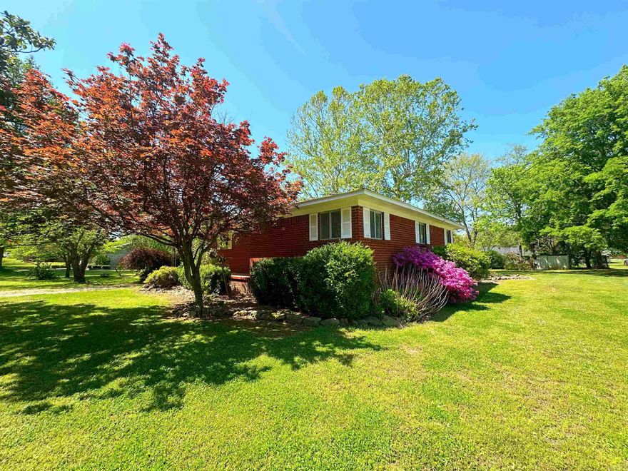 Talk about CURB APPEAL! This well maintained brick home sits on a beautifully manicured level lot complete with mature landscaping framing the house from every angle! Inside you will find a spacious living room and that happy medium semi-open floor plan that many desire! You will also find 2 bedrooms, 2 bathrooms, and a dedicated laundry room. Storage was not overlooked with this one! There are multiple hall closets and linen closets in addition to a walk in closet in the main bedroom and a storage building outside. The screened in porch is the perfect place to unwind and there is also a storm shelter for added peace of mind.