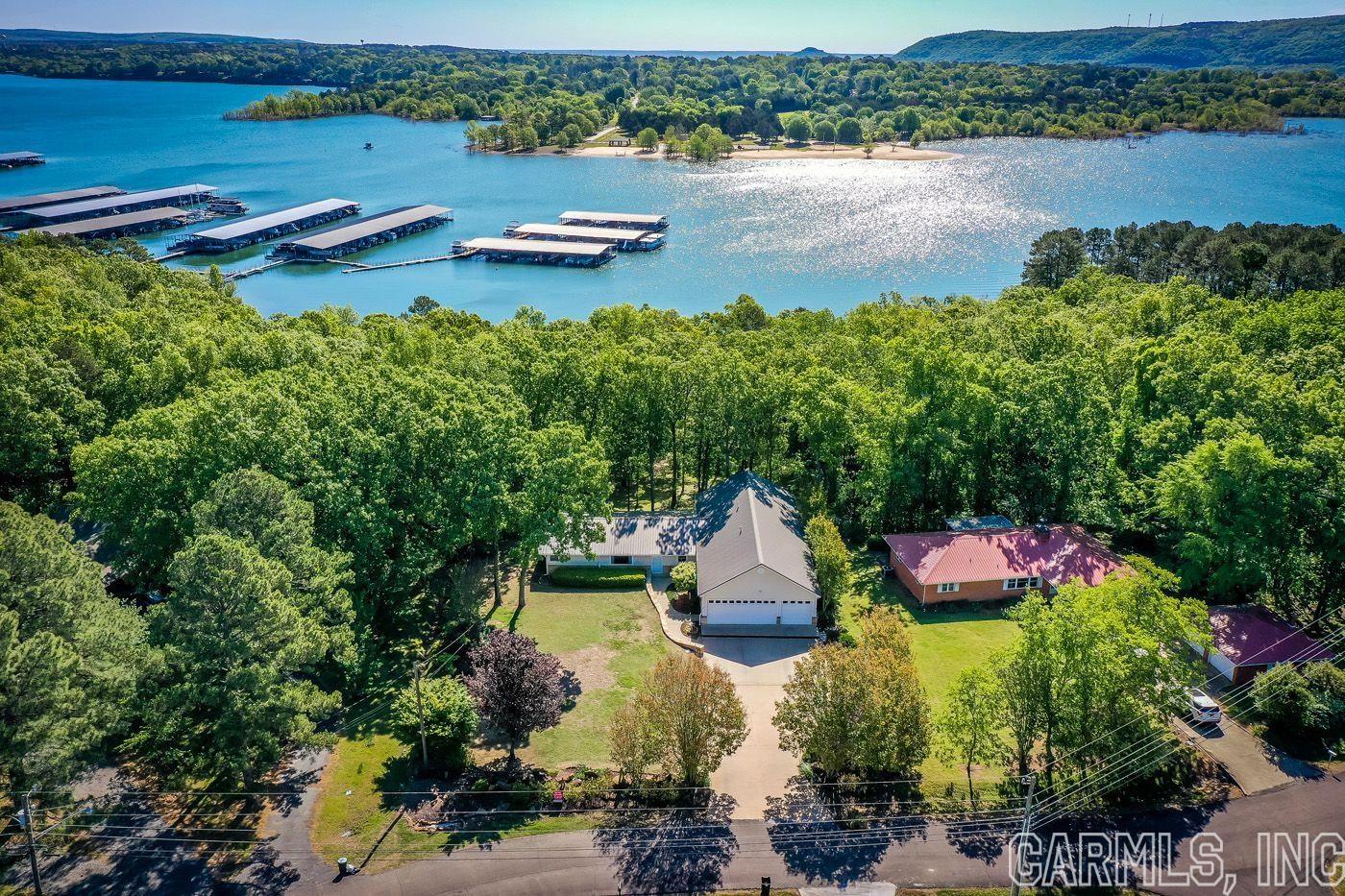 LAKEFRONT HOME IN HEBER SPRINGS, CRICKET COVE SUBDIVISION! This 3-bedroom lakefront home has everything for full-time or part-time living and entertaining on Greers Ferry Lake with easy walk to water! Home features a luxurious master suite and an extra large heated/cooled 6 car garage to store all your Lake toys! Call today to see this beauty!!