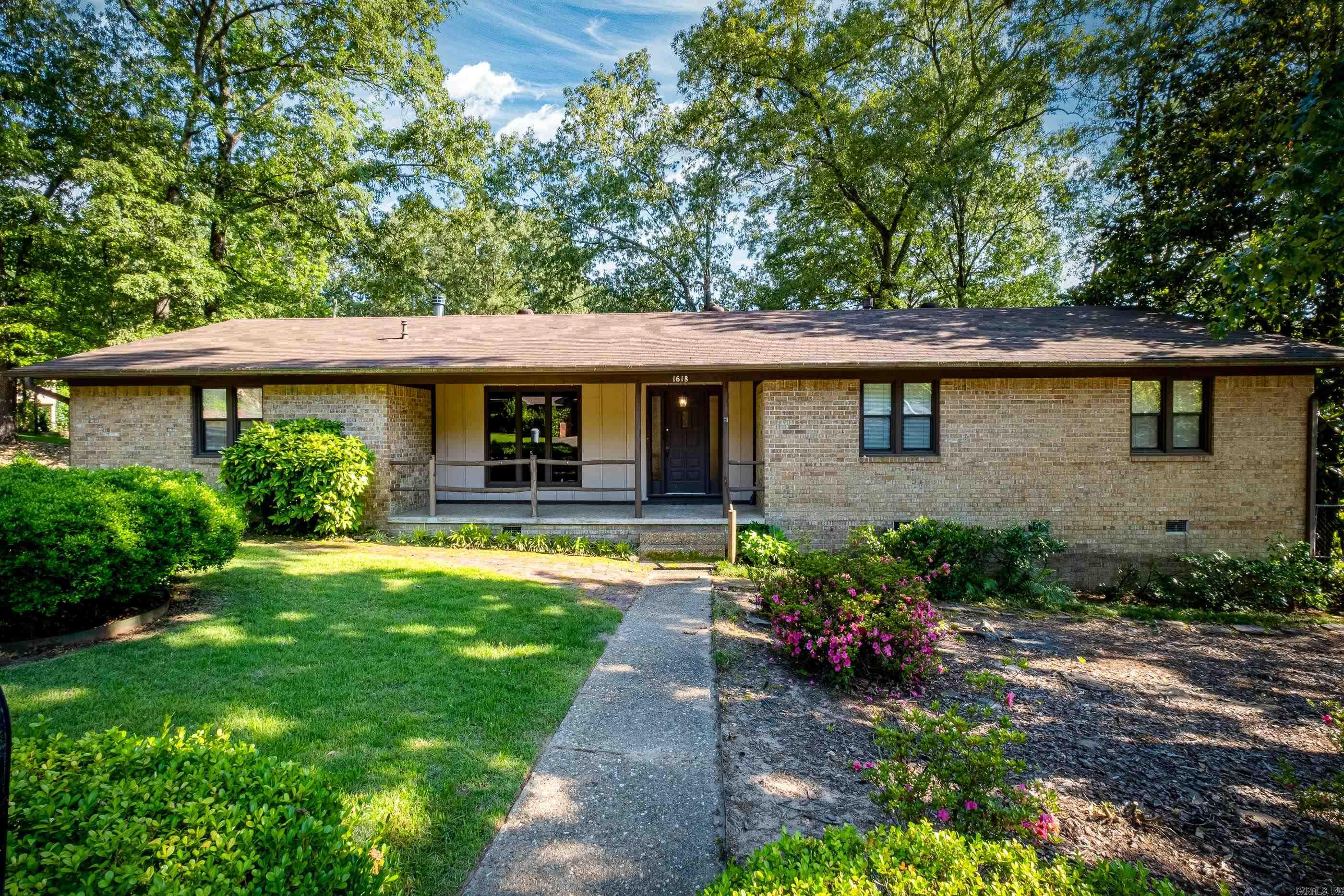 Such a find located in Brownwood Subdivision in Benton! Open floor plan, whole home generator, a fireplace and pantry you only see in homes built in this era, tons of storage, huge shop off of the carport, extra covered parking, large deck in the back, and located in the back of the development. Agents see remarks.
