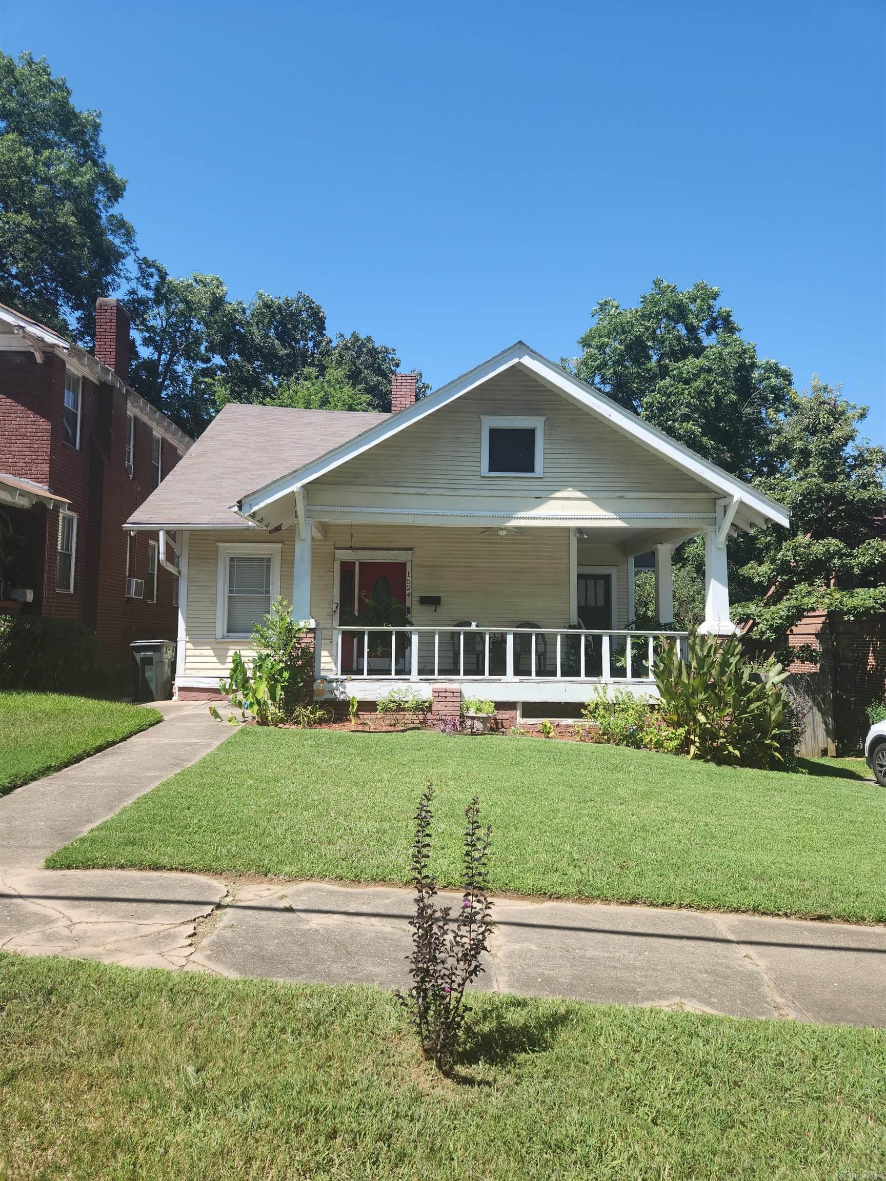 DID YOU SEE THE ARV OF THIS CHARMING CRAFTMANS STYLE HOME, NESTLED IN MID TOWN?? AS YOU KNOW, THIS AREA IS BEING REGENTRIFIED AND WITH A LITTLE ELBOW GREASE, THIS BEAUTY WILL SHINE LIKE A NEW PENNY! IT HAS EXTREMELY HIGH CEILINGS THROUGH OUT, MAKING THE HOME APPEAR MUCH LARGER. IT HAS MOSTLY HARDWOODS THROUGH OUT. 2 LIVING AREAS. SEPERATE BEDROOM UPSTAIRS WHICH WOULD BE GREAT FOR A TEEN OR ADDITIONAL LIVING AREA.WRAP AROUND PORCH. SUNROOM OVERLOOKING FENCED BACK YARD...UPDATED WINDOWS.. This one will not last long!! SOLD AS-IS....(SEE 03/2025 Inspection Report in Assoc. Documents).. INSPECTION WELCOME BUT ONLY FOR INFORMATIONAL PURPOSES****AGENTS SEE REMARKS****