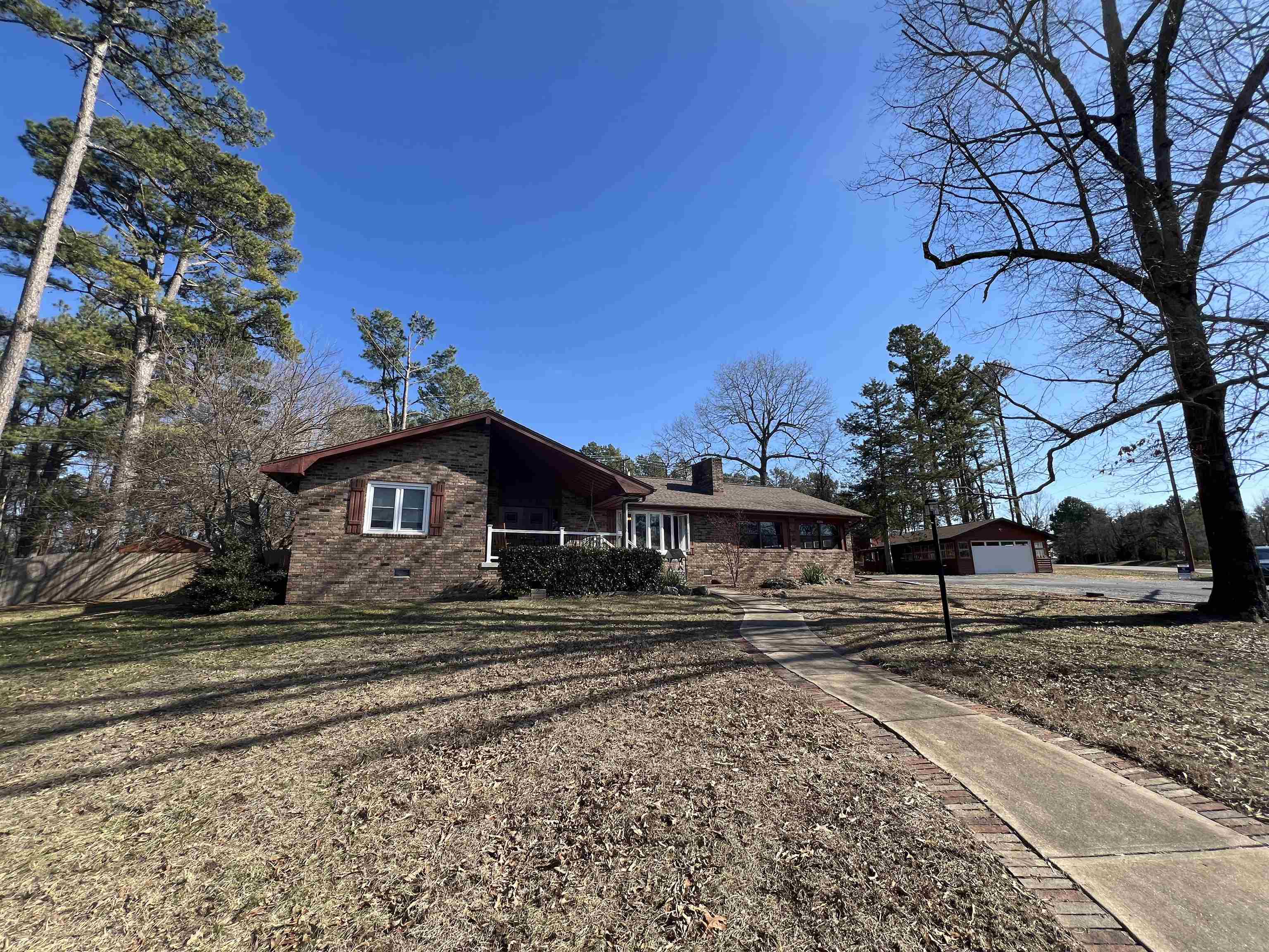 Nestled on 1.53 acres, this beautiful 3-bedroom, 2.5-bath all-brick home offers the perfect blend of country living and modern comfort. Located just minutes from the Buffalo River and Crooked Creek, this home offers easy access to world-class canoeing, breathtaking views, hiking, and fishing. Designed for low-maintenance living, it features a newer roof and heat pump, fresh paint, and newer flooring throughout. The open-concept living area boasts a large brick fireplace, bay windows, and a spacious kitchen with granite countertops, stainless steel appliances, and abundant cabinet space. A second living room with a stunning rock-accented fireplace leads to double doors opening to the fully fenced backyardāideal for kids, pets, or a garden. The primary suite includes a newly updated double vanity and walk-in shower. Outdoor living is effortless with a built-in brick grill, flower beds, and an air-conditioned dog house with a separate fenced area. With an attached two-car garage and an additional detached two-car garage, storage is never an issue! With this home you have space, convenience, & country lifestyle without all the maintenance!