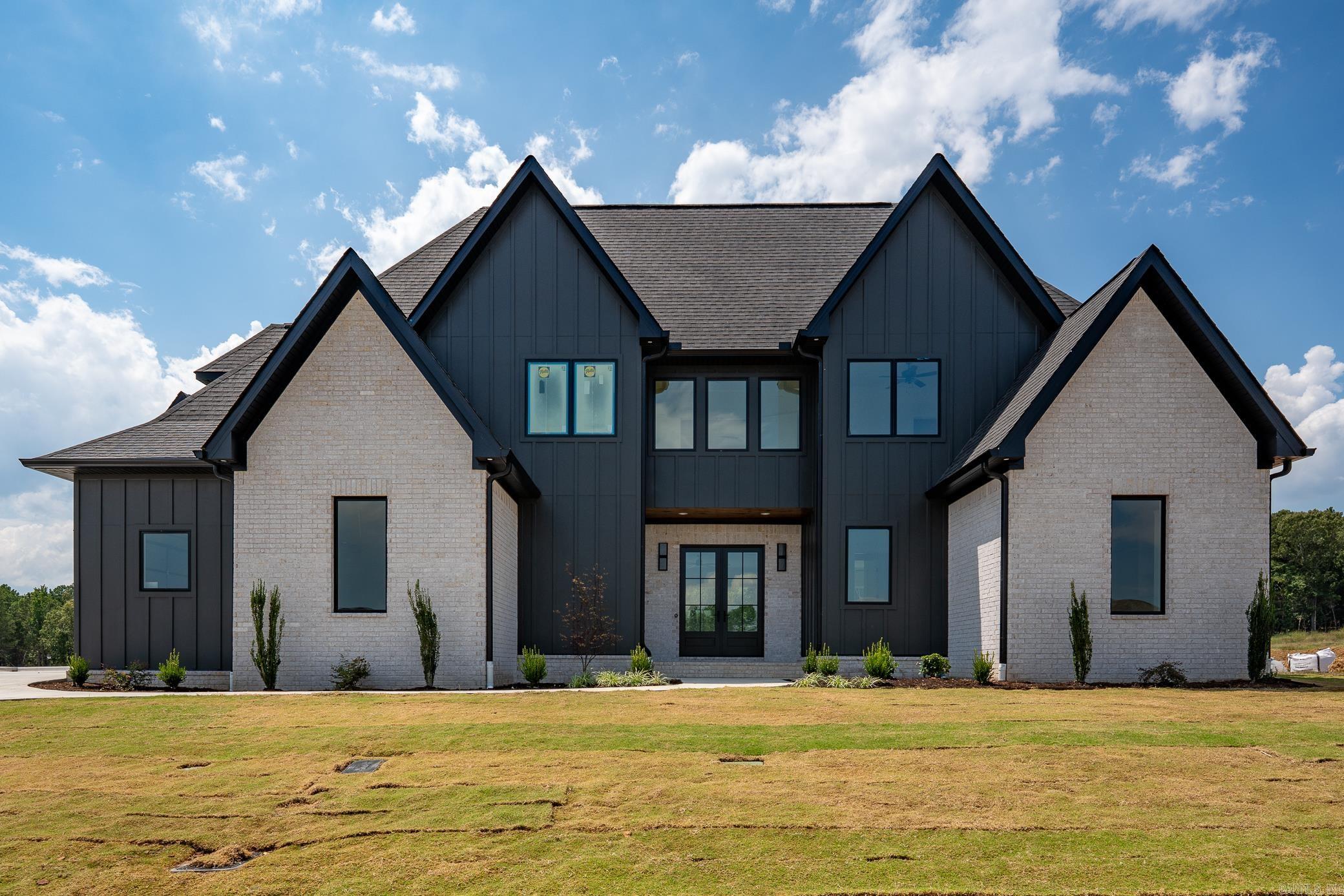 Stunning custom built home in Conwayās Lands End subdivision offering 5 bedrooms, 4.5 baths and 4192 ft.² with a wonderful open floor plan. The main level features a grand living room with tall ceilings, built-in cabinetry/bookshelves, stunning fireplace & engineered hardwood flooring adjacent to a gourmet kitchen w/ quartz & granite countertops, large center island, gas range, pot filler, side-by-side refrigerator/freezer and a wonderful dining area with access to the back covered patio.Ā The main level primary suite boasts a wonderful spacious bedroom and luxurious primary bath w/quartz countertops, double sinks, custom cabinetry, soaker tub, huge tiled walk-in shower & spacious custom closet with built-ins. Upstairs offers a game room, office, 4 additional bedrooms and a second laundry room.Ā Enjoy year-round outdoor living on the covered back porch with stained tongue-and-groove ceiling and gas grill hookup. Extras include two tankless water heaters, Pella windows, spray foam insulation, irrigation system, insulated 3-car garage with Wi-Fi openers and custom crown molding throughout. This home perfectly blends high-end finishes, thoughtful design and everyday comfort.