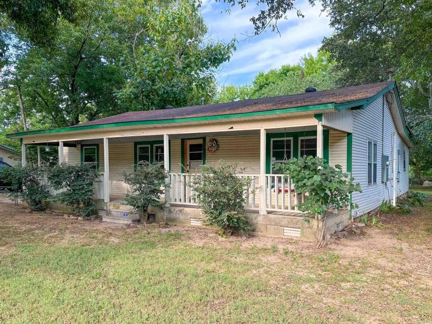 This ample-sized family home is in an affordable price range that is hard to find, and it qualifies for FHA, VA, and Rural Development loans. With almost 1,800 square feet, this home has a living room, as well as middle room that can be used as an office or flex space, and a sizeable kitchen with space for a large dining room table. The sunroom just off the kitchen has been converted into the laundry room. Step down from the laundry room into a bonus room that can be used as a workshop, craft room, or storage. There is a storm shelter in the back yard. Many updates have been made since 2018, including a new roof, updated plumbing and electric, retro-foam in the walls and blown cellulose in the attic, new water heater, and new flooring. There are still some projects left to be done, but the vast majority of the large items have already been taken care of. Convenient location, within walking distance to Mt. Vernon Enola Elementary, Dollar General, Enola One Stop, the post office, and Hayze Matthews Park.
