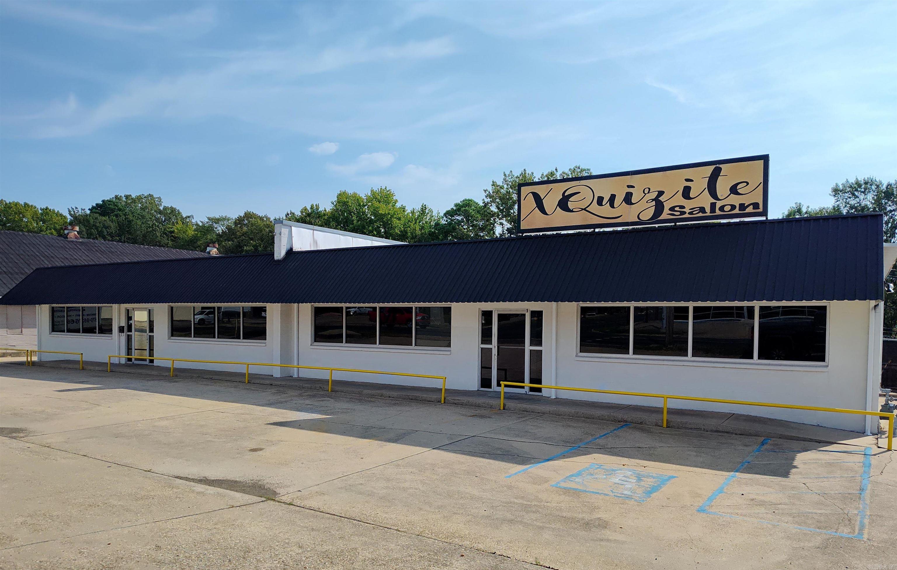 We are pleased to present an exceptional commercial property on N. West Ave. This prime real estate encompasses approximately 1 acre of land with an 8,000 square feet building. The building features a large retail space in the front with multiple offices, a huge garage with 7 drive in doors, and more office space in the back, making it an ideal investment opportunity. The versatile layout allows for the potential to be split into four separate units, catering to a variety of business needs and enhancing rental income opportunities. Don’t miss out on this chance to secure a prominent location that guarantees high visibility. Act quickly to take advantage of this remarkable offering!