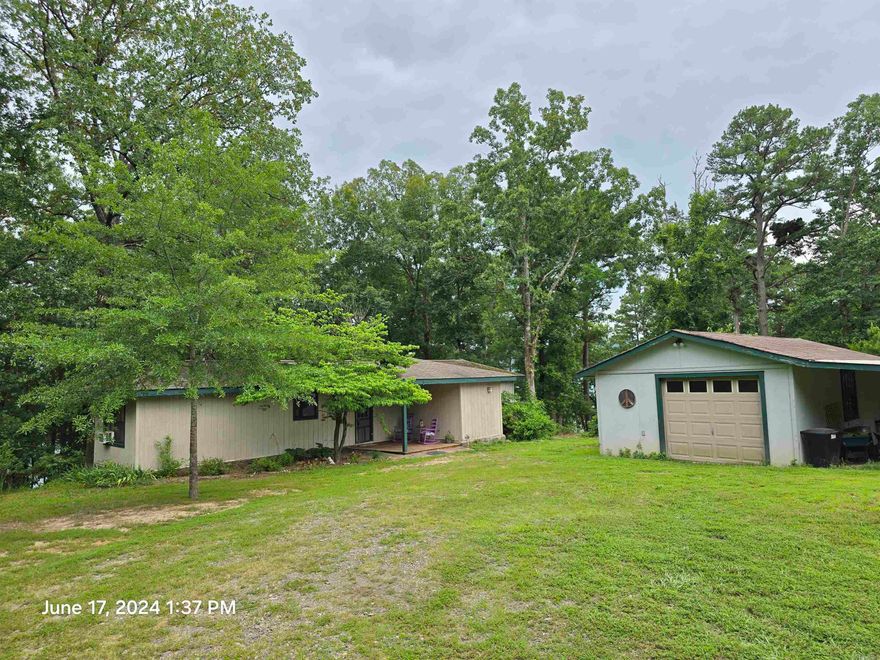 Lake front Sitting on 1.65 acres, has open floor plan with all wood floors updated wood cabinets, floor to ceiling windows that allow for an amazing view of the lake, a large soaking tub also overlooking a large back deck & lake the deck leads to the short path & easy walk to the lake front!  Home offers a detached garage, nice large yard for all outdoor fun !!