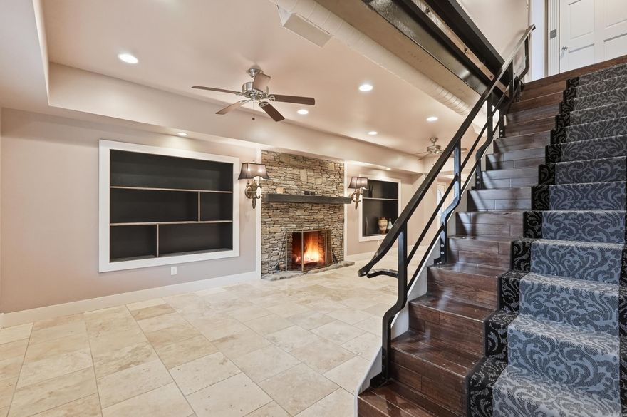 Spring Park Manor Unit A is a 3 story townhouse offering a unique downtown opportunity on the corner of iconic Spring Park. Ground floor includes living room with fireplace & ceiling fan + kitchen w brkfst bar &  half bath. There's also a fenced patio off the living room that's perfect for a small pet. The 2nd floor suite with fully renovated bath enjoys tile shower & floors as well as tub. 3rd floor has great mountain views. Amenities feature ample closet space & private bath w tile shower & floors. Design details in this home include elevator access + extra wide staircases w tile & hardwood floors throughout. Zoned climate controls supported by 2 HVAC units for central heat & air ensure year round comfort.  There's also covered entry, private patio, balcony overlooking the park and detached, assigned parking. Proximity to Greer's Ferry Lake, Little Red River, Eden Isle, & Sugarloaf Mountain make this well thought out home the perfect spot to enjoy all lake life has to offer including easy access to 3 golf courses, world class trout fishing, dining, shopping, & healthcare. Walk to cafes, boutique shopping, banking, and the Gem Theater