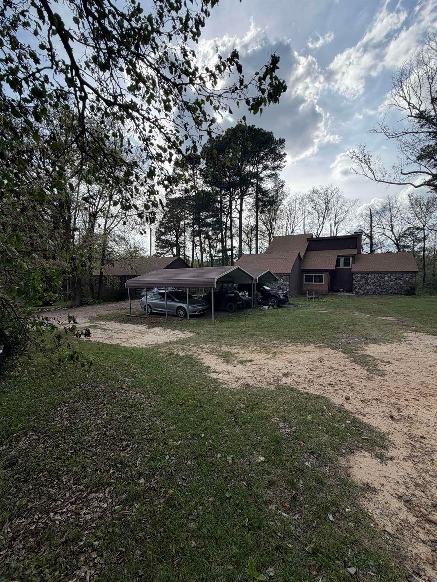 Two-story rock and wood-sided home located on the edge of town, offering the perfect balance of convenience and country living. Situated on 8.5 acres, this 3 bedroom, 2.5 bath home provides plenty of space both inside and out. The property also includes a separate 2 bedroom, 2 bath mother-in-law home—ideal for extended family, guests, or potential rental income. Enjoy a peaceful setting while sitting on the back deck, with a scenic creek running along the back of the property. Recent updates include a new roof in 2021, new water heater in 2022, and new windows installed in 2024. A rare opportunity to own acreage with privacy while still being just minutes from town amenities. Agents see remarks