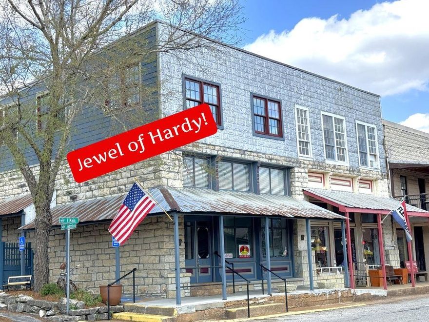 JEWEL OF HARDY!! Historic & Unique Building in Hardy, AR! Approx. 4258 sq. ft. which includes beautiful show room, dressing room, work rooms, storage. Fantastic living space complete with kitchen, 2 beautiful bathrooms, 2 bedrooms, large walk-in closet, 2 bath, dining room, living room, large pantry-freezer stays, large laundry room (washer-dryer stay) with extra storage, also beautifully remodeled Studio Apartment-Work-out room, craft room, bonus room- all as nice as they can be. Solid wood doors in living areas. There is basement area could be easily utilized with sink and stool. Property was remodeled in 2017 including new 20-30 yr roof. Patio is back for you to relax ....Extra parking is owned in rear of property- a rare commodity in Hardy...City water and Sewer. This property has been updated to very high standards-A list of updates available. I don't believe you can find another property on Main St that can compare.... If you are considering commercial real estate, you sincerely need to consider this well-maintained property listed on the National Register of Historic Places. Commercial area, living apt and studio all have their own entrances. Opportunities are endless...