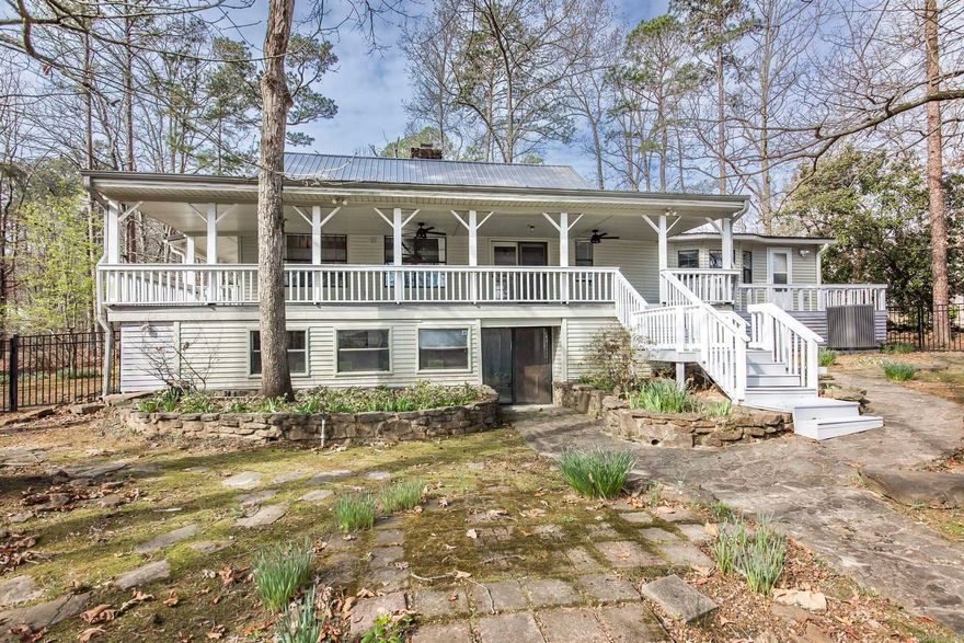 A peaceful retreat on the water's edge of Greers Ferry Lake surrounded by mature woods, soft moss and blooming gardens! Lakefront Home in the enchanted Mystic Isle Subdivision with easy walk to water, home has been completely renovated with updated kitchen and bathrooms. The generously proportioned interior flows effortlessly from the open-plan living space to the private rear patio perfect for family gatherings! All of this situated in a convenient, friendly neighborhood. Call today to see this lovely property!