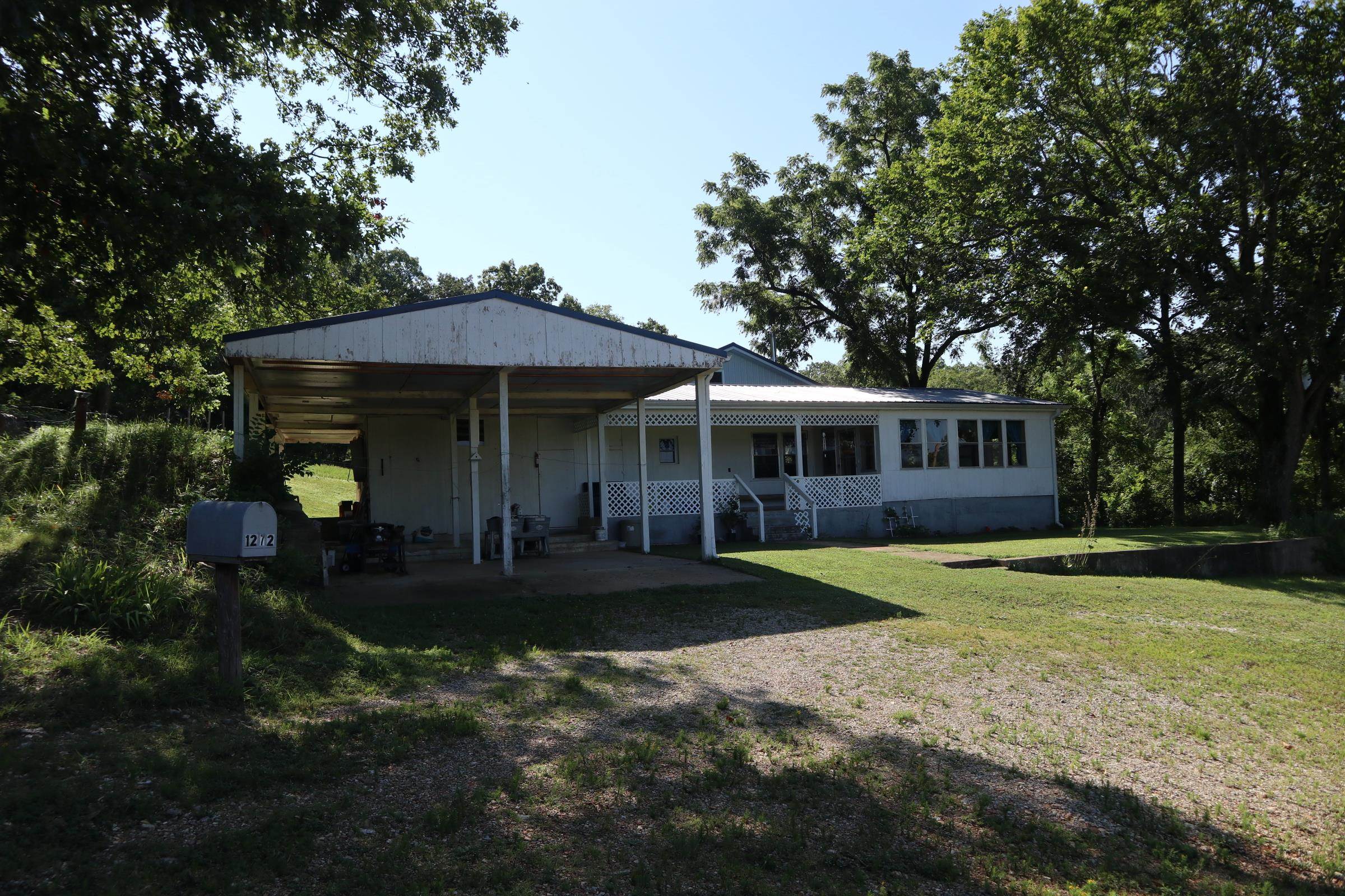 OFF GRID HOBBY FARM AND HOME FOR SALE STURKIE ARKANSAS Property is located at 1272 Sunrise Rd, Sturkie, AR. The property has 12.6 acres. The house has approx. 1,268 sq. ft. of living area with a total of 4 bedrooms, 2 baths. There is aĀ loft area that has 2 of the bedrooms. There is a 2 car carport, large covered porches, storm cellarĀ and a shaded yard.This property is currently off grid but does have electricity on site. It has a drilled well and septic system. The home consist of a mobile home that has been built on to. It has a newer metal roof. One of the additions was constructed in 2018. It has several outbuildings including a 21 x 28 storage building with lean to, a 15 x 16 storage shed, 14 x 20 barn with concrete floor and a 12 x16 open shed. It has a large garden area. There is approx. 4 acres of pasture with the balance in woods. It also has a great hilltop view. This property would be ideal for a few head of sheep, goats, horses or cattle. County road frontage and is only 1/4 to a public access on the Southfork River. The real estate taxes last year was $274.15. No appliances are included in the sale. The current owners have an air pump for well that is not included.