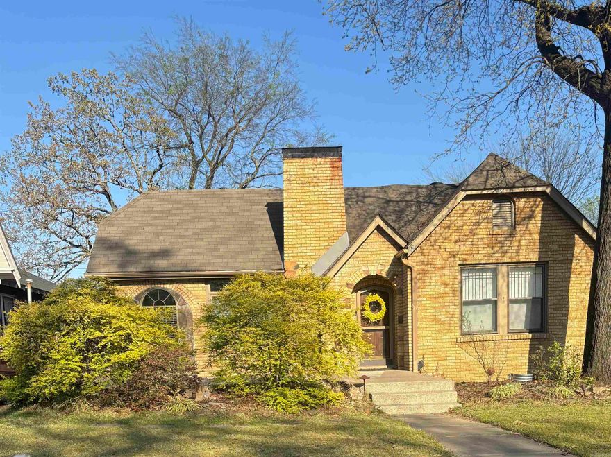Charming Historic Bungalow in Park Hill   Nestled in the sought-after Park Hill neighborhood, this inviting 3-bedroom, 2-bathroom bungalow combines timeless vintage character with modern conveniences across 2,158?sq?ft on a generous 0.17-acre lot  Built in 1945, this one-story brick and vinyl-sided home retains original wood flooring and classic bungalow charm throughout. A chef’s kitchen offers granite countertops, stainless appliances, a gas cooktop with griddle, and a cozy hearth for gathering. Enjoy two ambient gas-log fireplaces in the den and hearth room for warmth and character  Spacious primary suite addition features 10' ceilings, custom built-ins, and a relaxing sitting area overlooking the backyard; adjacent is a luxurious bath with granite surfaces. Two additional bedrooms share a well-appointed full bath, all on the main level. French doors open from the kitchen to a large paved patio—one of three outdoor entertaining areas, including a deck and landscaped zones with lighting. Fully fenced lot provides privacy and space for play or gardening, with attractive level terrain. Detached 1-car garage and parking pad provide storage and guest convenience.