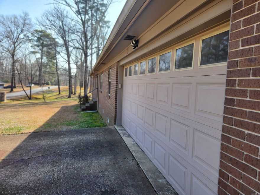 Come home to this beautiful, well maintained home in the country, with all the towns amenities just a couple of minutes away! Enjoy the two spacious living areas with a floor plan conducive to entertaining during the holidays or every day family living!  Stainless steel kitchen appliances, (Refrigerator Stays), Custom granite counter tops, elegant pendent lighting over the breakfast bar, separate dining area, wood burning fireplace, spacious bedrooms, custom laundry room and ample storage!  Two car garage with custom shelving  and an abundance of storage options!  All brick 3 bedroom and 2 bath home on a flat ONE ACRE LOT!  This one will not last long, call or text for an appointment to view today!