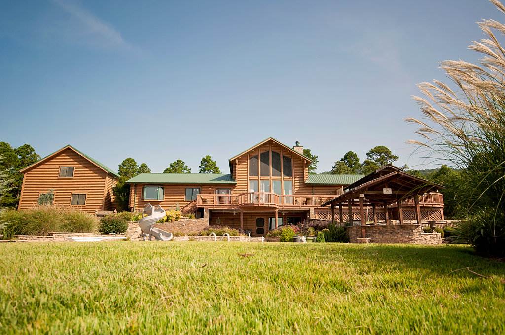 FABULOUS HOME WITH EVERY LUXURY AMMENITY. THE MOST AMAZING VIEWS FROM EVERY PART OF THIS SECULDED PROPERTY THAT BACKS UP TO THE OZARK NATIONAL FOREST. MASSIVE WINDOWS, VAULTED CEILINGS. SEVERAL FIREPLCES. KITCHEN IS EVERY COOKS DREAM. CUSTOM CABINETS OFFER PLACE FOR EVERYTHING.  LARGE HEATED POOL, WITH AN OUTDOOR KITCHEN. HOT TUB. HUGE 40X60 SHOP, HEATED AND COOLED. EXTRA APARTMENT OVER AN OVERSIZED TWO CAR GARAGE. POND. OUTDOOR COVERED AREA WITH A LARGE FIREPLACE AND BATHROOM. TOO MANY AMMENITIES TO LIST