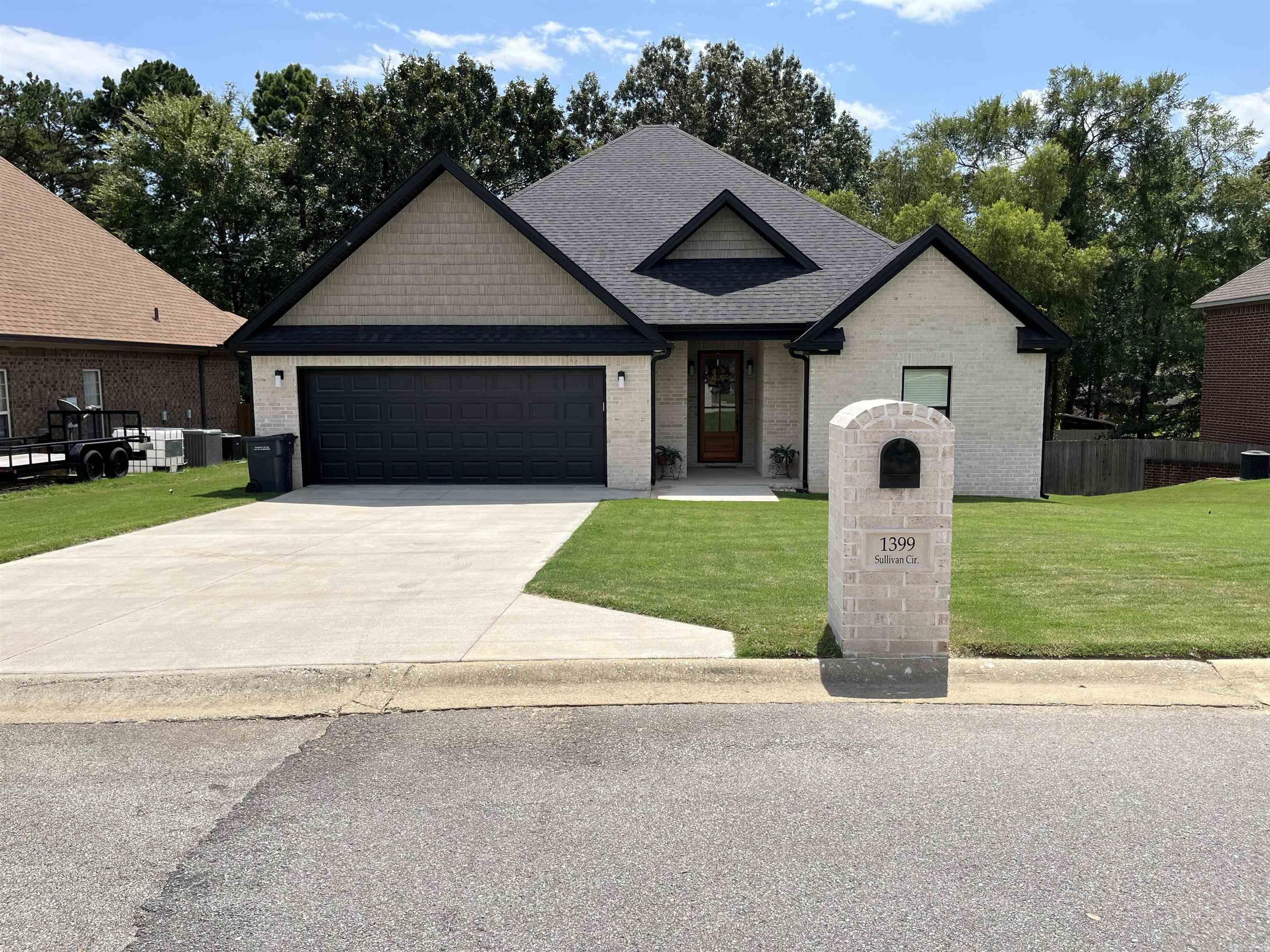 Almost New Construction, just over one year. Owner has New Commitment out of State, must move for New Job Opportunity. Nestled just moments away from the serene Craighead Forest Park, this stunning brick home is a dream come true for those seeking contemporary living in a prime location. Key Features: Spacious and Stylish: Soar with the 10ft ceilings, adding an airy, grand feel to every room. Revel in preparing culinary delights in this kitchen, complete with granite countertops and stainless steel appliances. Luxury meets Comfort: Three cozy bedrooms and two elegant bathrooms, each designed with sophistication in mind. Modern Open Concept: Flow seamlessly from one space to another in an open, inviting layout perfect for entertaining and daily life. Work and Relax: A dedicated office space for your productivity needs, coupled with a serene, screened-in covered porch. Imagine enjoying your mornings and evenings overlooking your lush backyard, supported by stylish brick columns. Durable and Chic Flooring: Luxury vinyl plank flooring, combining durability with modern aesthetics. By the Way, did I mention the Electric Vehicle Charger in the Two car Garage.