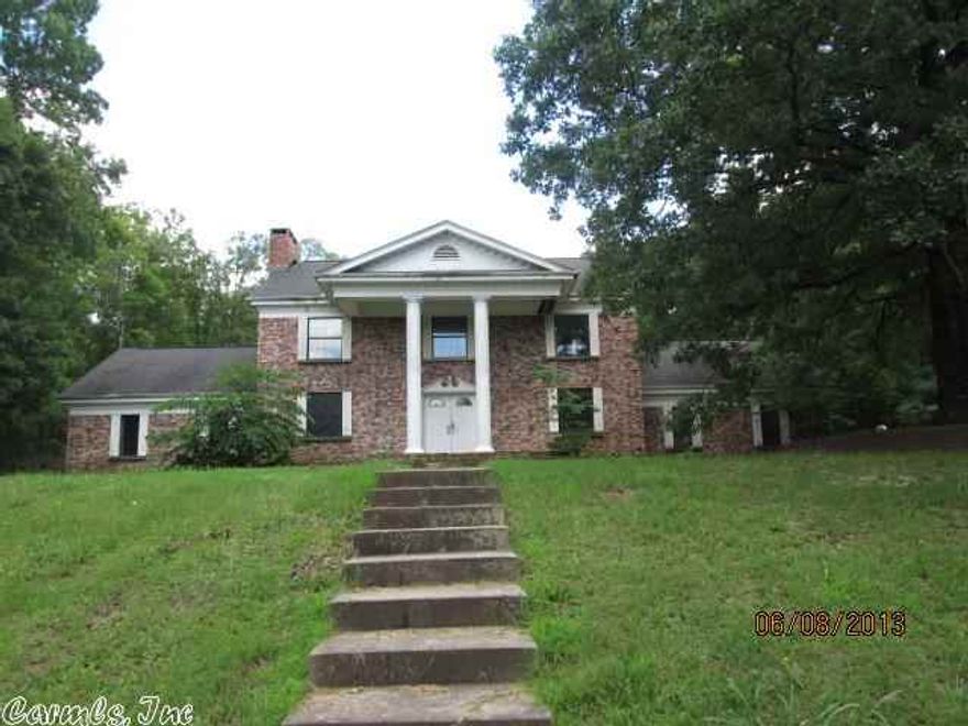 Two story brick home with large front porch. Four bedrooms upstairs with two full bathrooms. Lots of open space for entertaining or a growing family. House has a lot of potential --although it will be a handyman special. Located on large country lot with lots of extras. All offers must be submitted on www.auction.com .