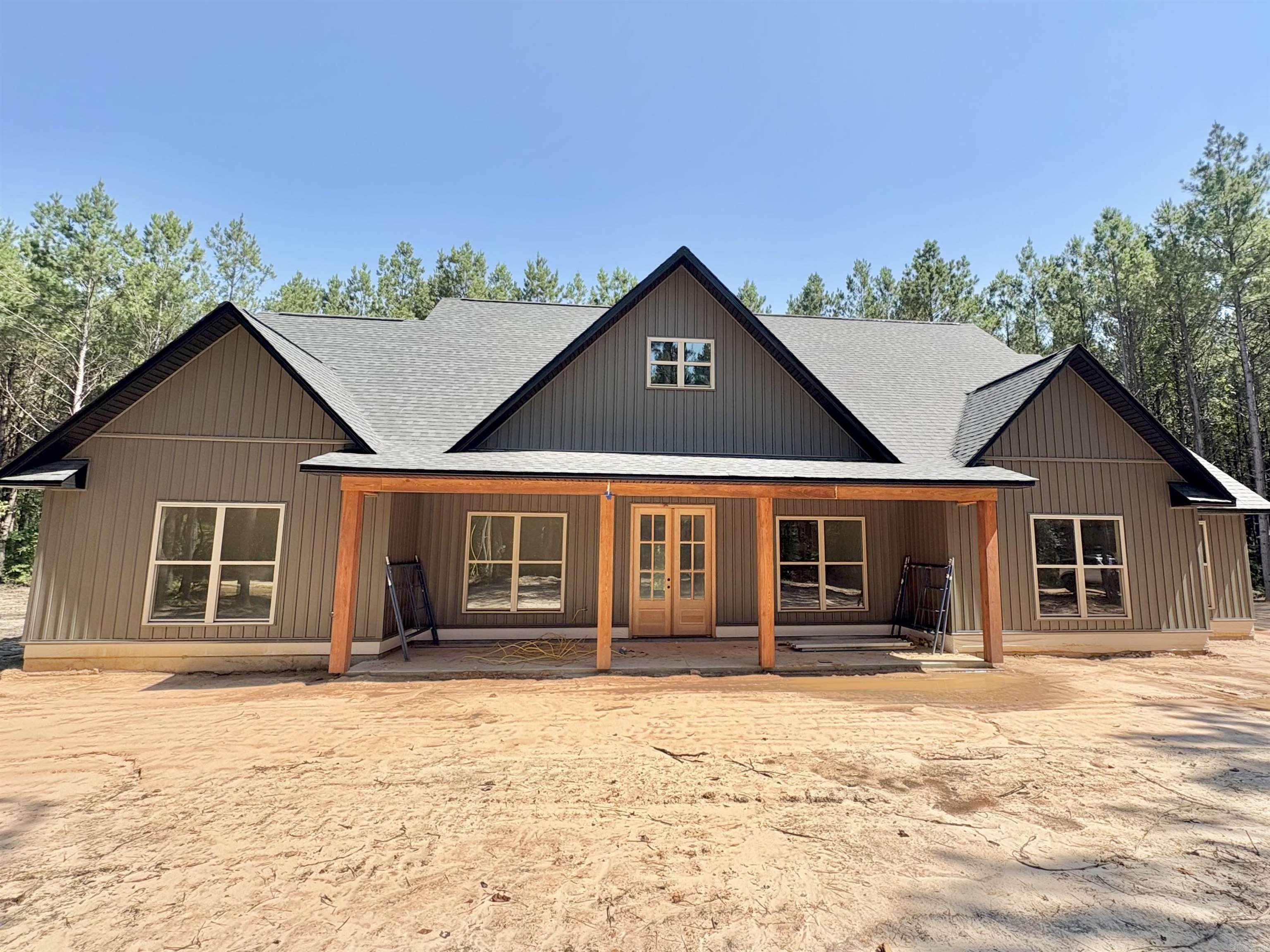 This stunning 4 bedroom, 2.5 bath home offers 2,340 sq ft of thoughtfully designed living space, nestled on a spacious 1.5 acre lot. From the moment you step inside, you'll be wondering if someone custom built this one for you! You'll find vaulted ceiling & a show stopping floor to ceiling fireplace accent & large windows that anchor the open concept living area. The kitchen is a dream- featuring beautiful granite countertops, floating shelves, custom cabinets, an oversized walk in pantry & large island with complementing lighting. A spacious dining room with large window finishes off the area well. The primary suite is a true retreat, with a huge walk in closet & a spa like bathroom with a custom tiled shower. The oversized laundry room is as functional as it is beautiful-featuring custom cabinetry, a convenient utility sink & folding/hanging space for organization but best of all is the location, right off of the primary closet and bathroom. Tucked between the kitchen and laundry. just off of the garage is a half bath. Exterior:wood accented porch ceilings, shutters & wood accent posts. Enjoy peaceful country living with modern comforts of a new home.Pics to be updated asap