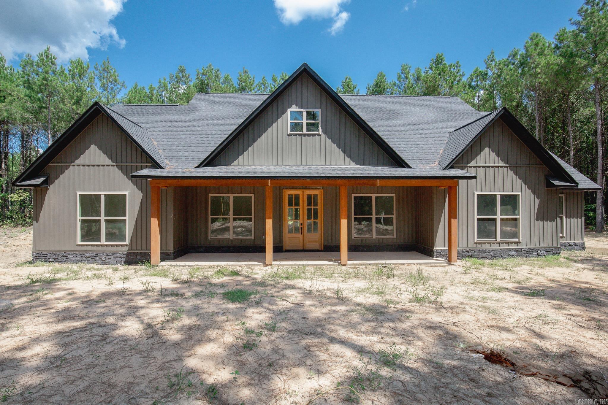 This stunning 4 bedroom, 2.5 bath home offers 2,340 sq ft of thoughtfully designed living space, nestled on a spacious 1.5 acre lot. From the moment you step inside, you'll be wondering if someone custom built this one for you! You'll find vaulted ceiling & a show stopping floor to ceiling fireplace accent & large windows that anchor the open concept living area. The kitchen is a dream- featuring beautiful granite countertops, floating shelves, custom cabinets, an oversized walk in pantry & large island with complementing lighting. A spacious dining room with large window finishes off the area well. The primary suite is a true retreat, with a huge walk in closet & a spa like bathroom with a custom tiled shower. The oversized laundry room is as functional as it is beautiful-featuring custom cabinetry, a convenient utility sink & folding/hanging space for organization but best of all is the location, right off of the primary closet and bathroom. Tucked between the kitchen and laundry. just off of the garage is a half bath. Exterior:wood accented porch ceilings, shutters & wood accent posts. Enjoy peaceful country living with modern comforts of a new home.Pics to be updated asap