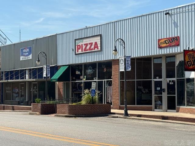 Turnkey Pizza Restaurant in Historic Downtown Pocahontas, AR A rare opportunity to own a fully operational, turnkey pizza restaurant located in the heart of Pocahontasā vibrant and Historic Downtown District. This iconic establishment is housed in one of the area's original late-1800s buildings, boasting preserved architectural character including original tin ceiling tiles that reflect the rich history and timeless charm of the district. This well-established business is a cornerstone of downtown, with a loyal customer base and a reputation for quality. The sale includes the building, all restaurant equipment, cookware, ovens, tables, chairs, and current inventoryāeverything needed to step in and continue operations without interruption. With prime visibility and foot traffic, this location is perfect for anyone looking to invest in a thriving business and contribute to the continued revitalization of Historic Downtown Pocahontas.