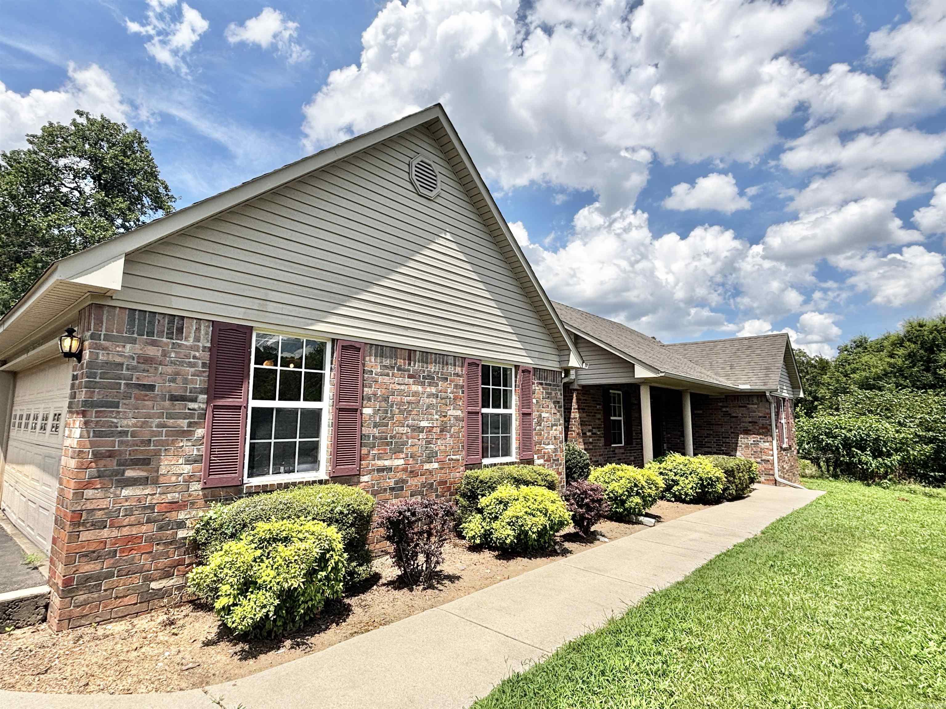 Charming 3 Bed, 2 Bath Brick Home in Morrilton! Welcome to this well-maintained brick home offering comfort, space, and style. Featuring 3 bedrooms and 2 full baths, this home includes a desirable split floor plan for added privacy. The primary suite boasts a spacious walk-in shower and generous closet space. The kitchen is perfect for everyday living and entertaining, with a breakfast bar and open layout that flows into the dining area. You'll love the large closets throughout and the convenience of a 2-car garage for parking and storage. Located in a tucked-away neighborhood, this home is move-in ready and waiting for you! **Agents see agent remarks**