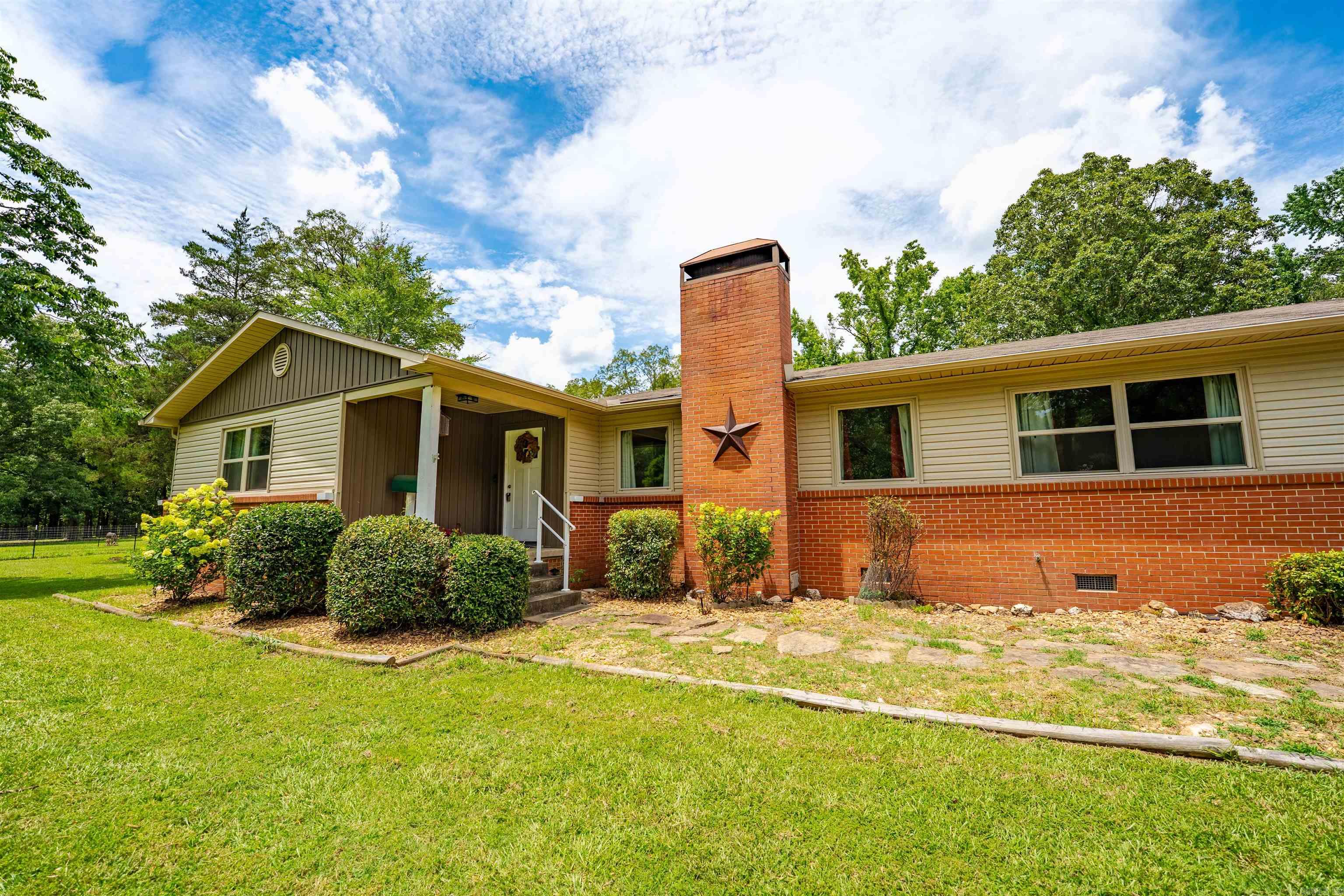 Looking for space, privacy and modern updates, all while staying close to town? This house checks all the boxes. Step inside to an inviting living area with an open layout and a fireplace, perfect for winding down after a long day or gathering with friends. Just off the main space, the updated kitchen features leathered granite countertops and plenty of storage. With 2 bedrooms and 2 fully updated modern bathrooms the layout offers both comfort and functionality. Outside enjoy over 2 acres of land and a 600 square foot insulated shop with electricity, complete with a covered patio. Come see if it's yours. 220 W Lawson Road. Welcome home