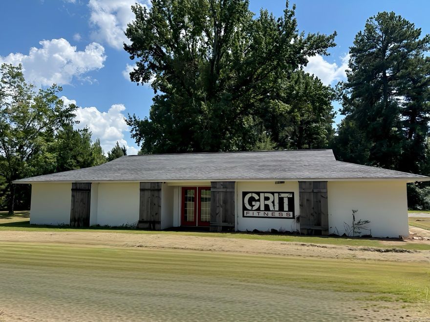 Currently commercial property office space near I30, with potential for residential use! Previously a gym, suitable for office space or dance studio. Large lot on 1 acre with private driveway, parking available behind building.