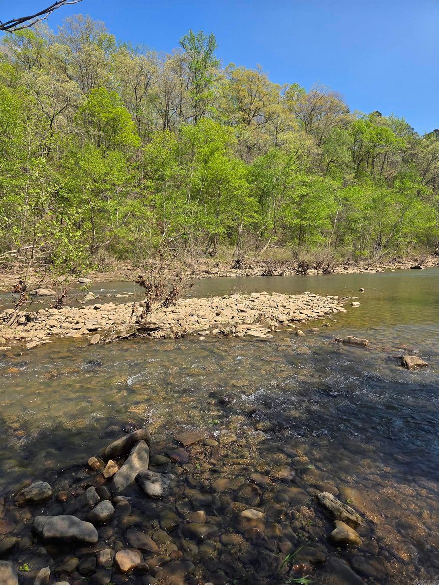 25.33 acres of Middle Fork Little Red River land. Stave oak trees, 2,000 feet of river frontage with land on both sides of the road. This is a phenomenal opportunity!